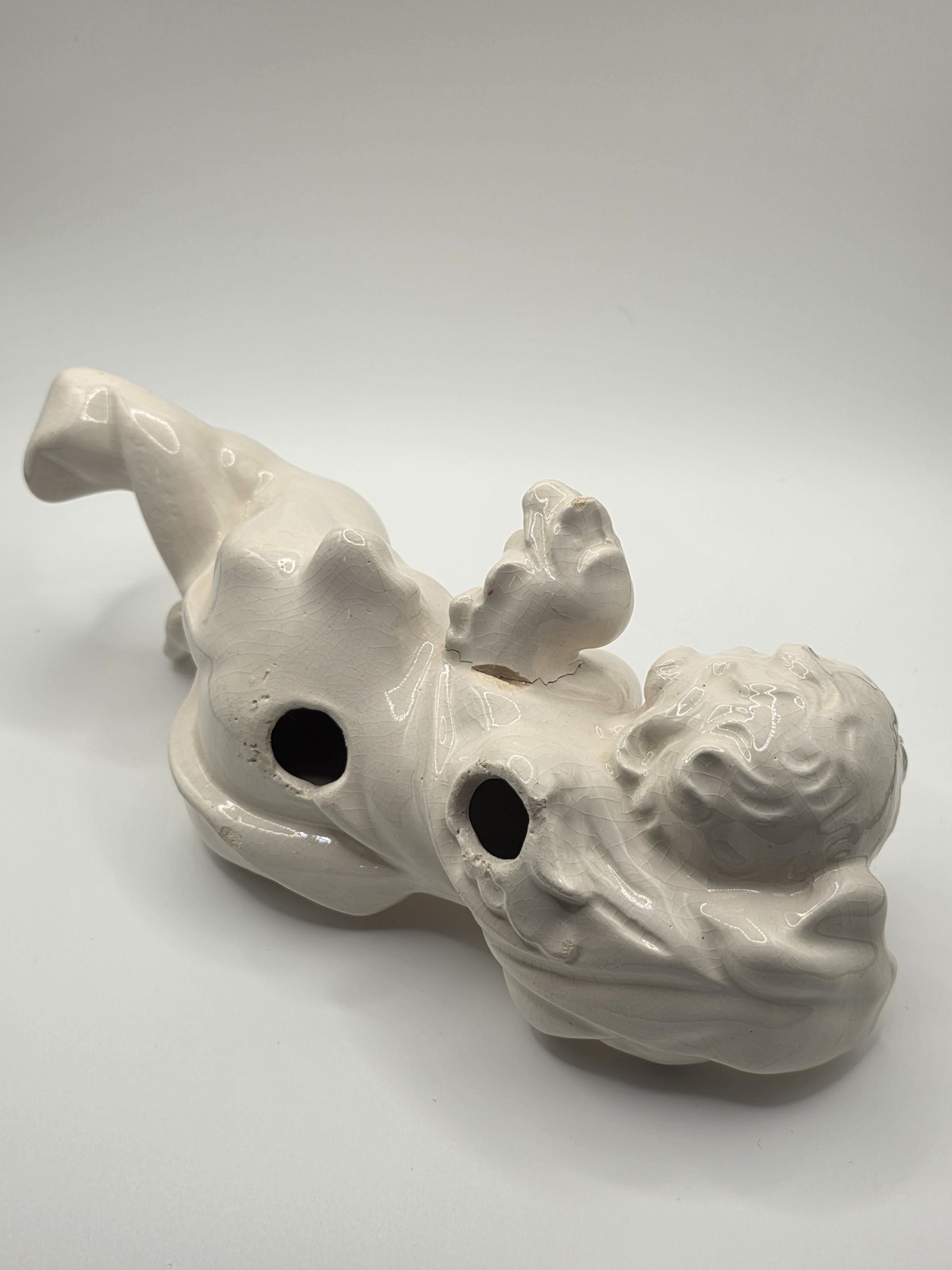 Vintage Ceramic Cherub Angel Figurine Reclining on Scroll Base – Cracks/Read