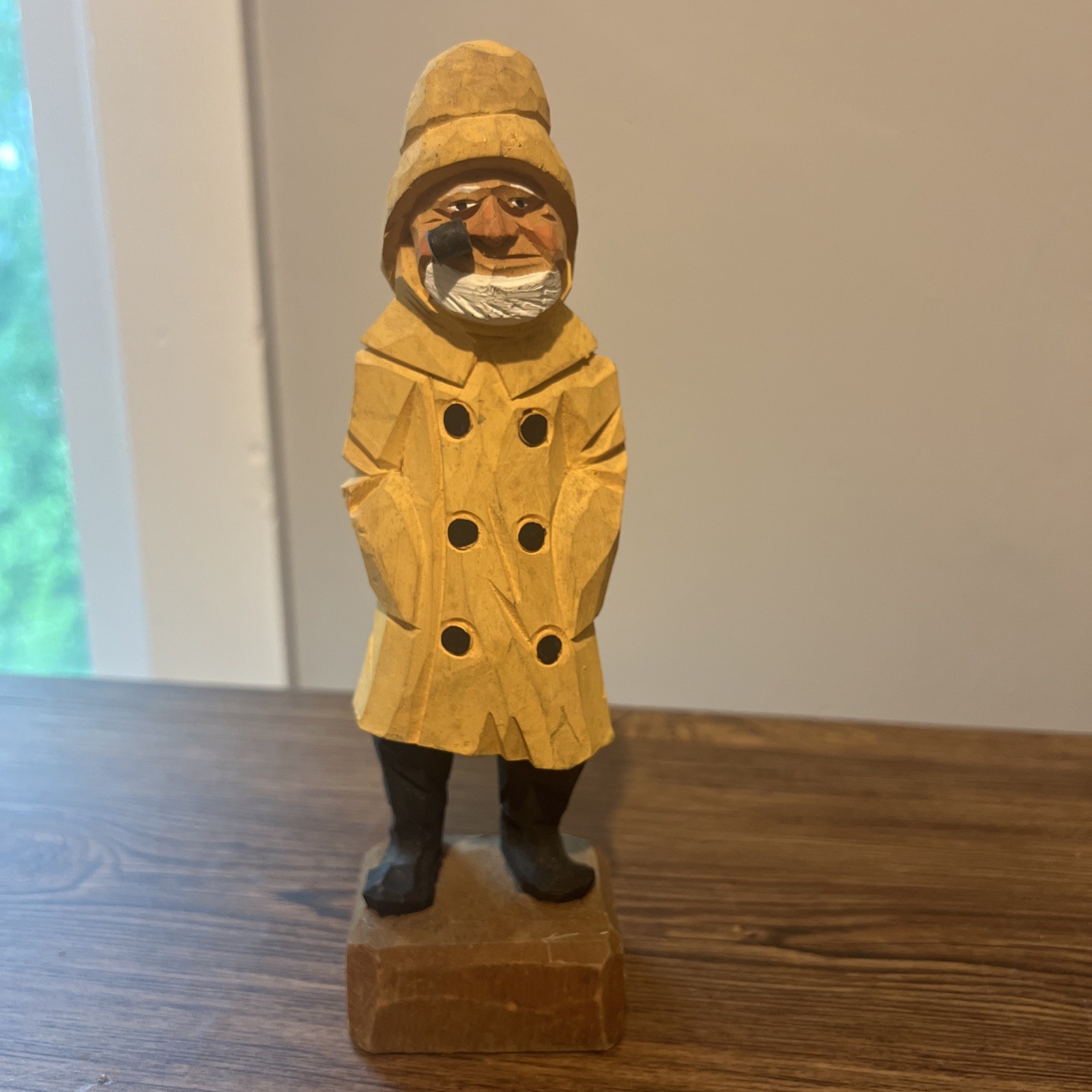Hand-carved wooden folk-art figure of a fisherman
