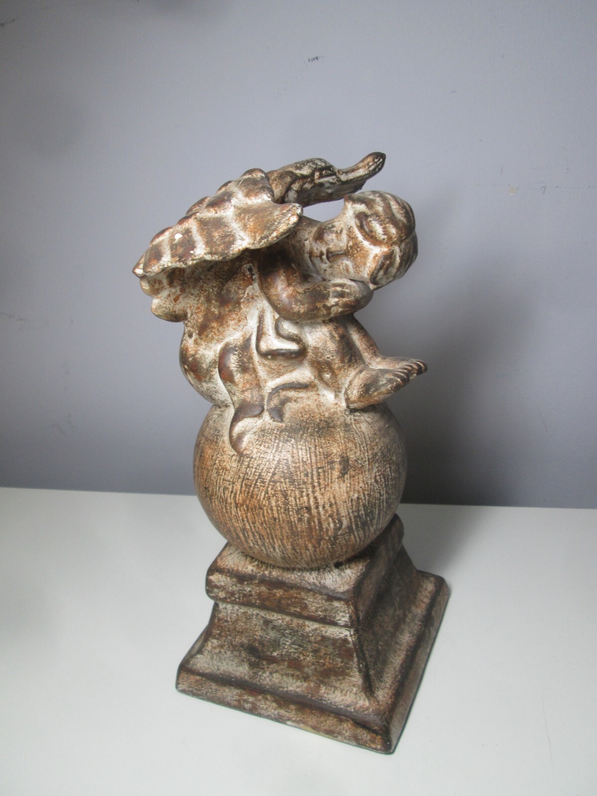 Ceramic Cherub on a Globe inside or outside Décor