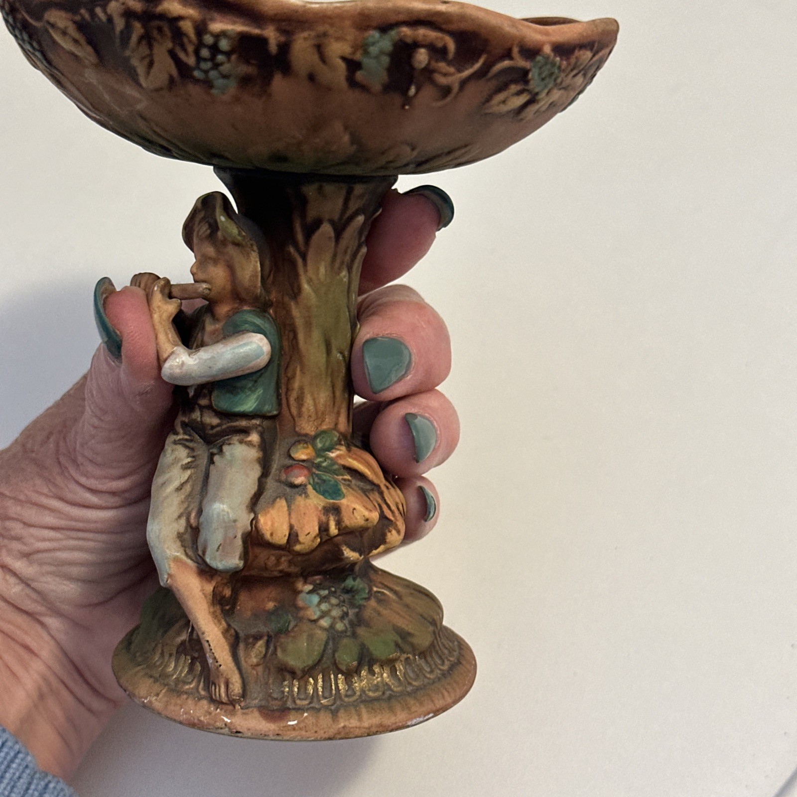 Vintage Arcadia ceramic dish boy with flute 9″ x 6″ Muted tones