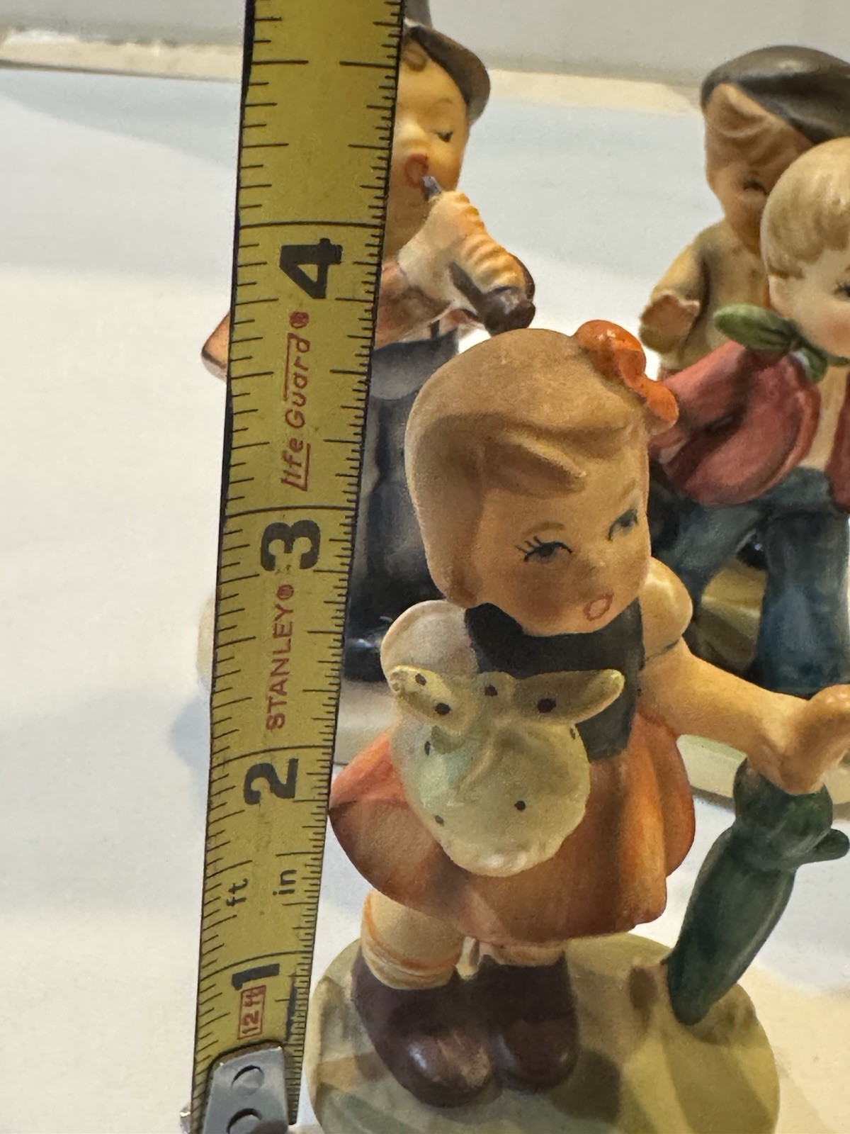 VNTG Lot of 4 Napcoware Porcelain Figurines- Bowling, Sailboat, Flute, Umbrella