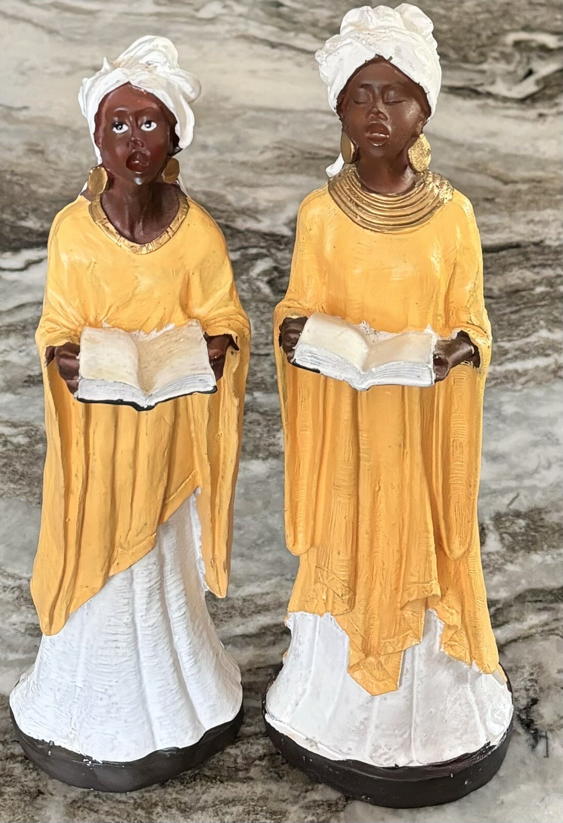 Figurine of 2 African women singing in church – 10 1/4″ Yellow