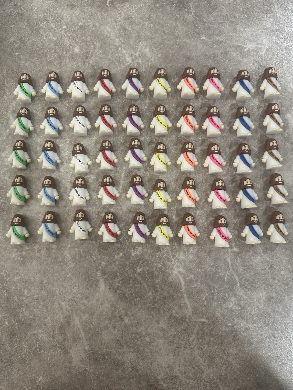 100 Pack of Mini Jesus Figurines Multicolor Plastic Miniature Religious Favors