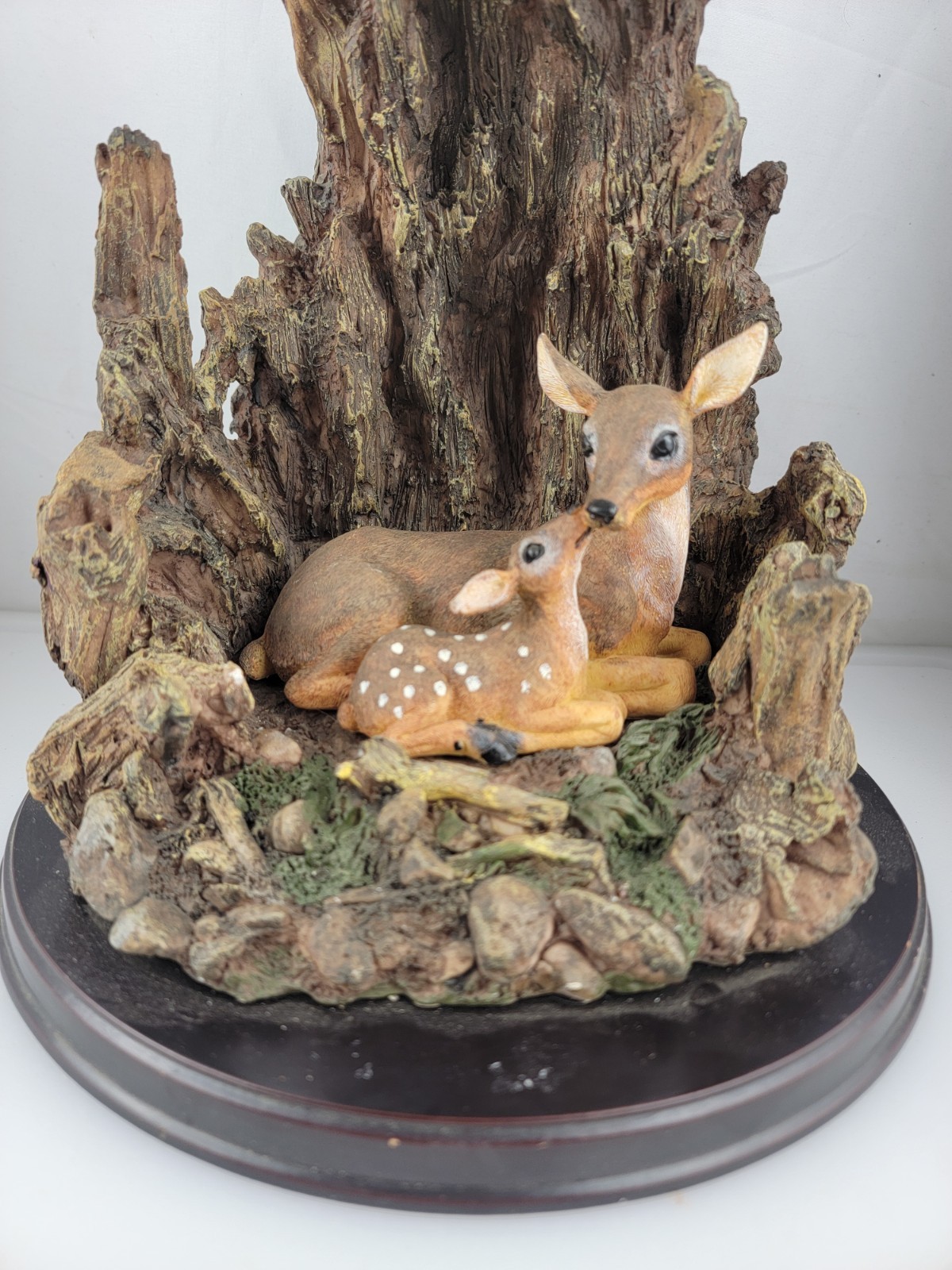 12″ Masterpiece Resin Deer, Fawn Resting Cave/ Tree Trunk Wodeen Base