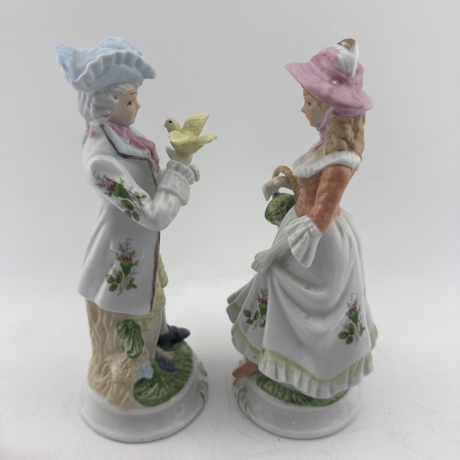 Vintage Colonial Porcelain Couple Figurines Man Bird Woman Basket