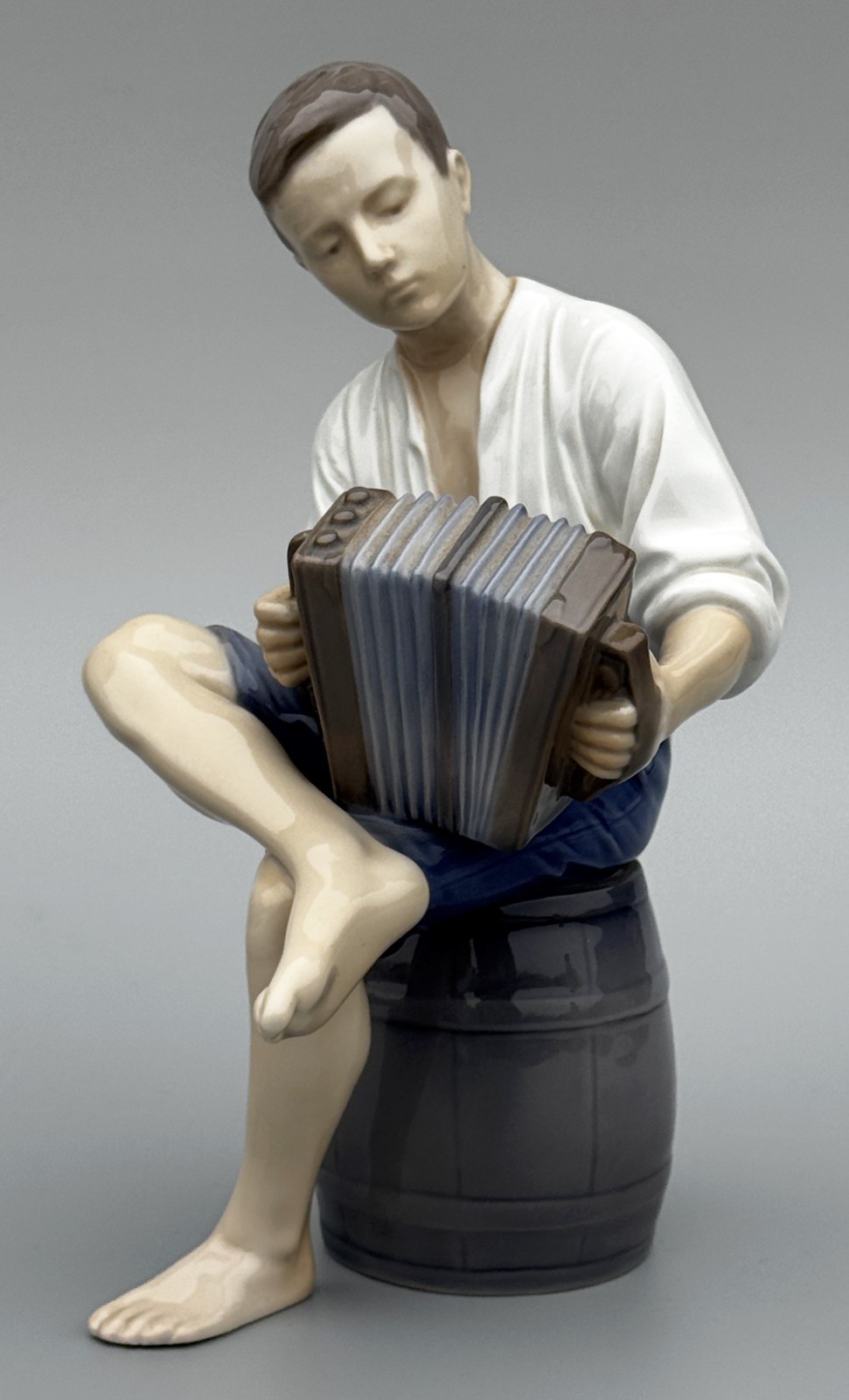 B&G Royal Copenhagen Porcelain Figurine “Merry Sailor Boy w/ Accordion”, 9″ Tall