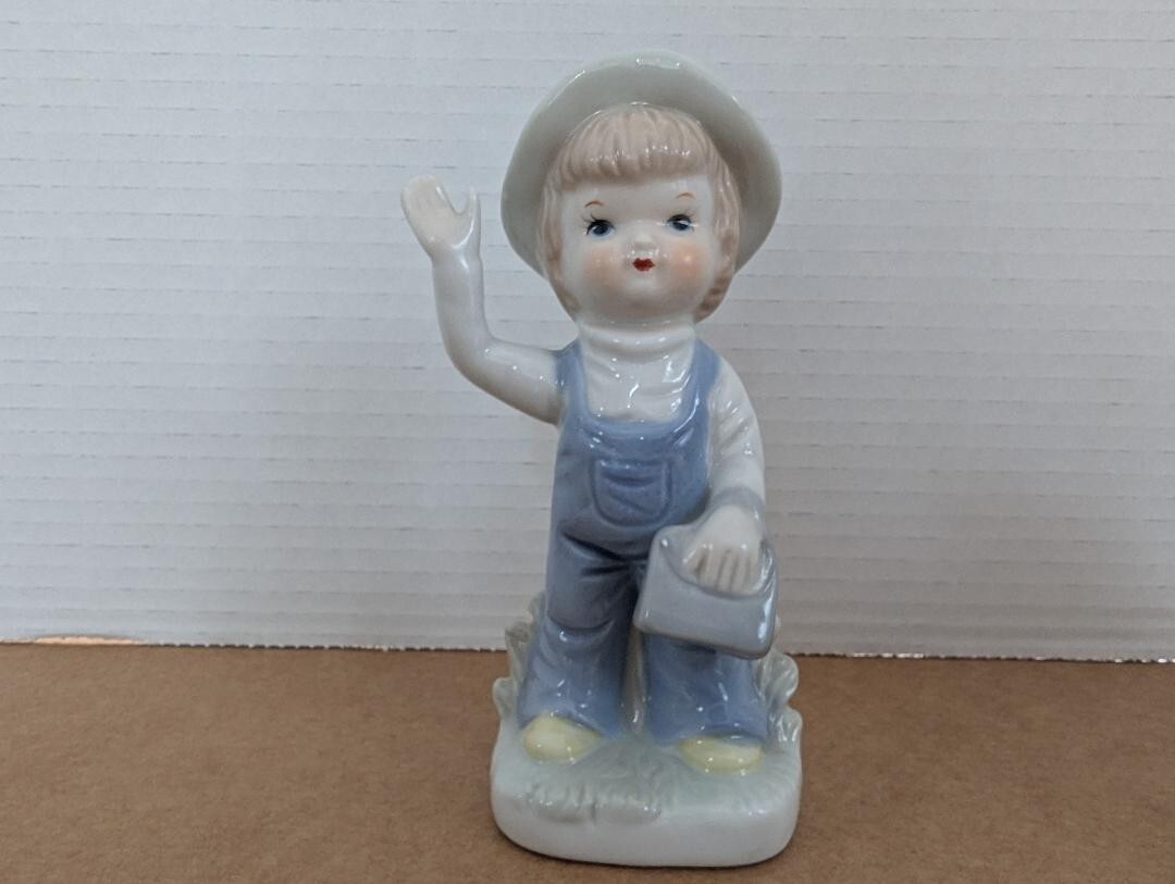Vintage Girl Figurine Porcelain Girl with Purse wearing Overalls