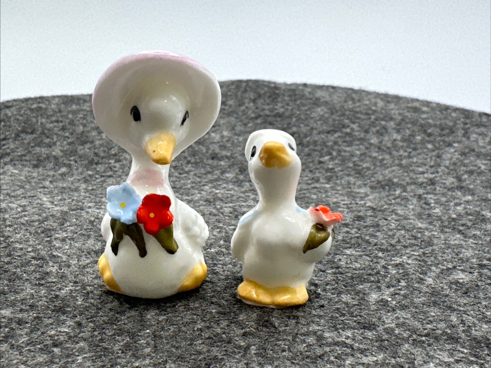VTG Mother Goose And Baby Boy Mini Porcelain Figurines Holding Flowers