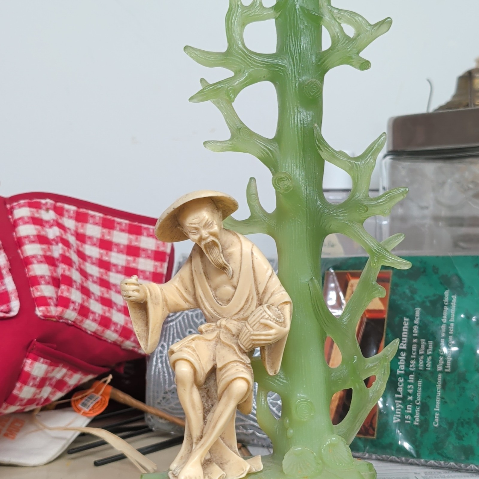 Plastic 3D Effect Figurine Seated Man in Hat Holding Staff with Green Tree