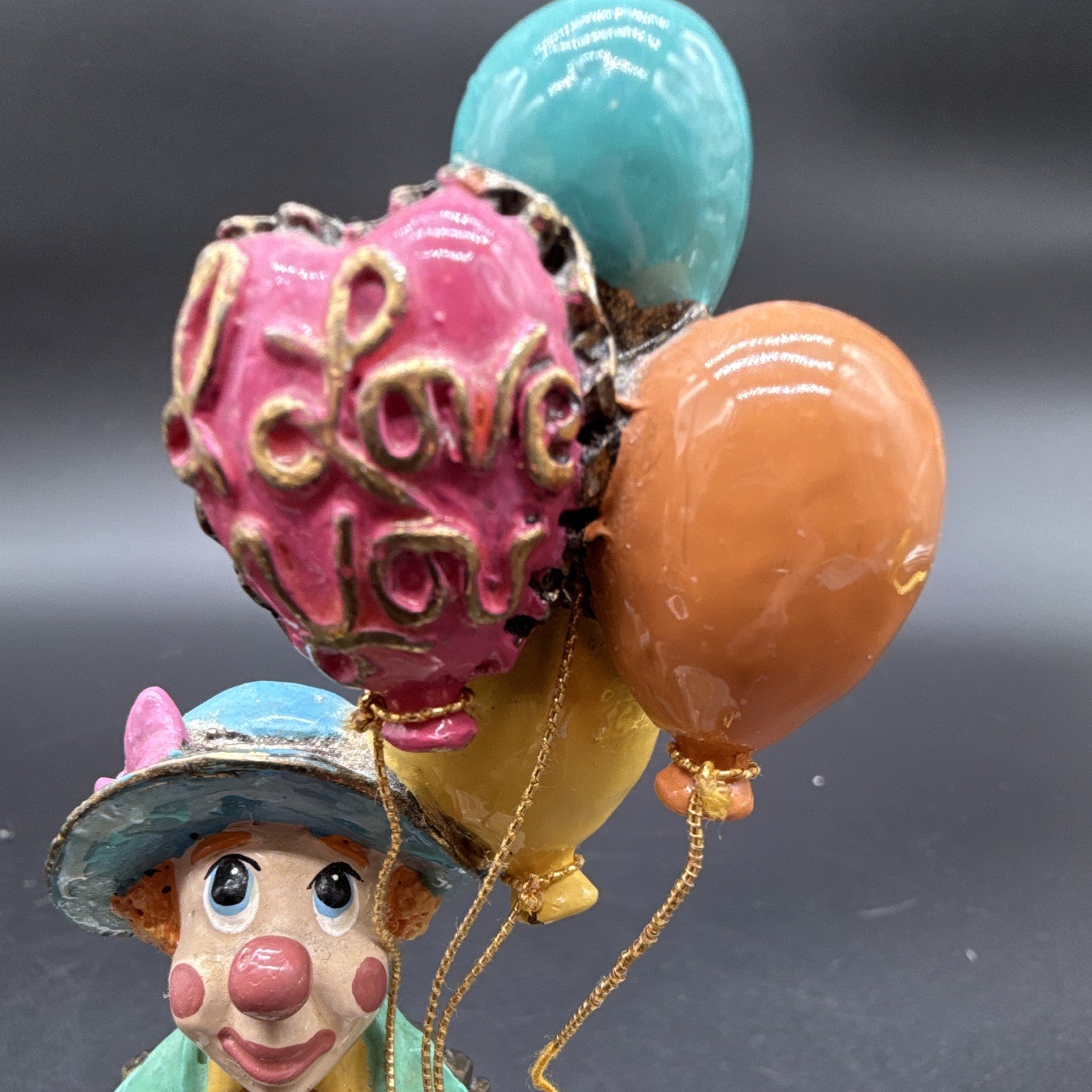 Ron Lee signed hand-painted clown figurine with balloons on stone base, 1987