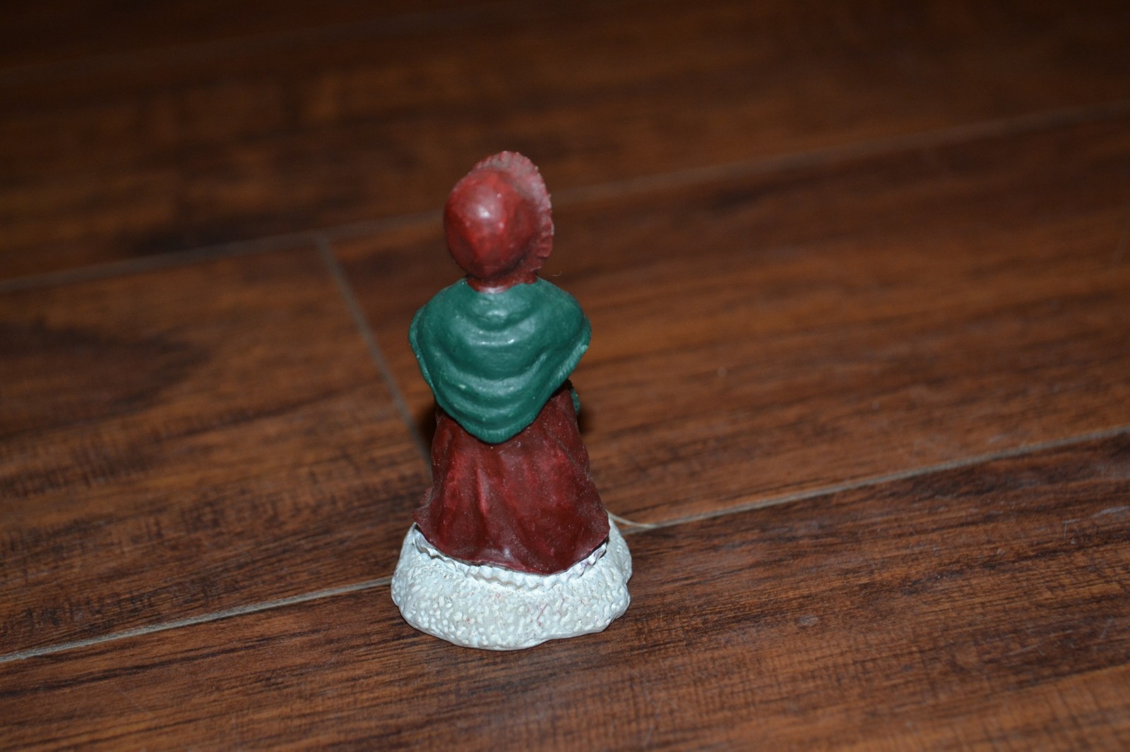 E18- approx. 2.5″ Woman w/ Coat, Hat & Basket
