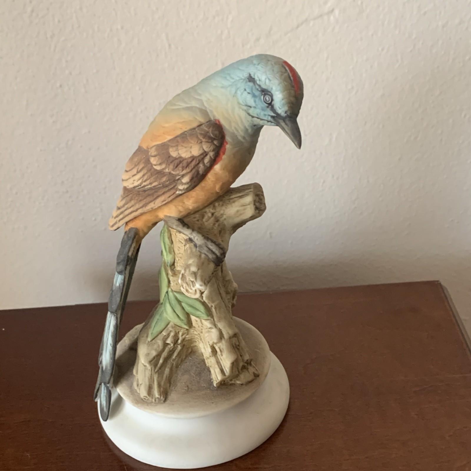 Hand Painted Ceramic Bird Figurine Blue Brown White Green on Branch Base