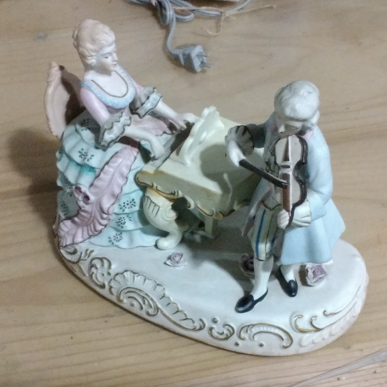 Hand painted bisque figurine couple playing music