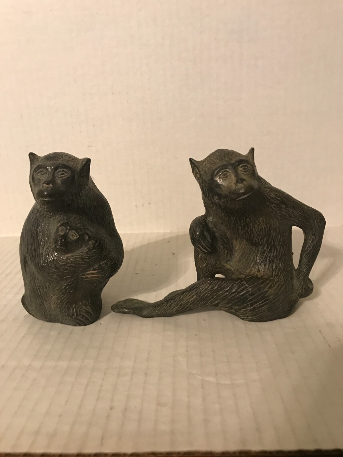 VINTAGE PAIR OF HEAVY METAL MONKEY FIGURINES, FATHER, AND MOTHER HOLDING BABY