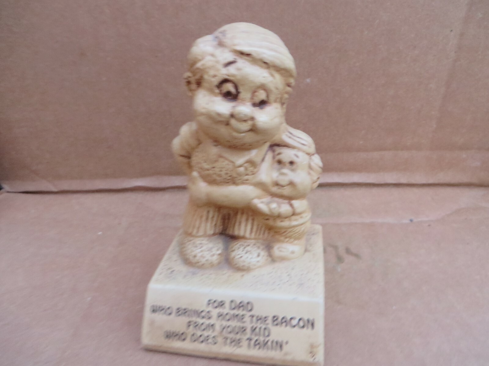 Vintage 1970’s american dream Figure dad brings home the bacon kids are taking