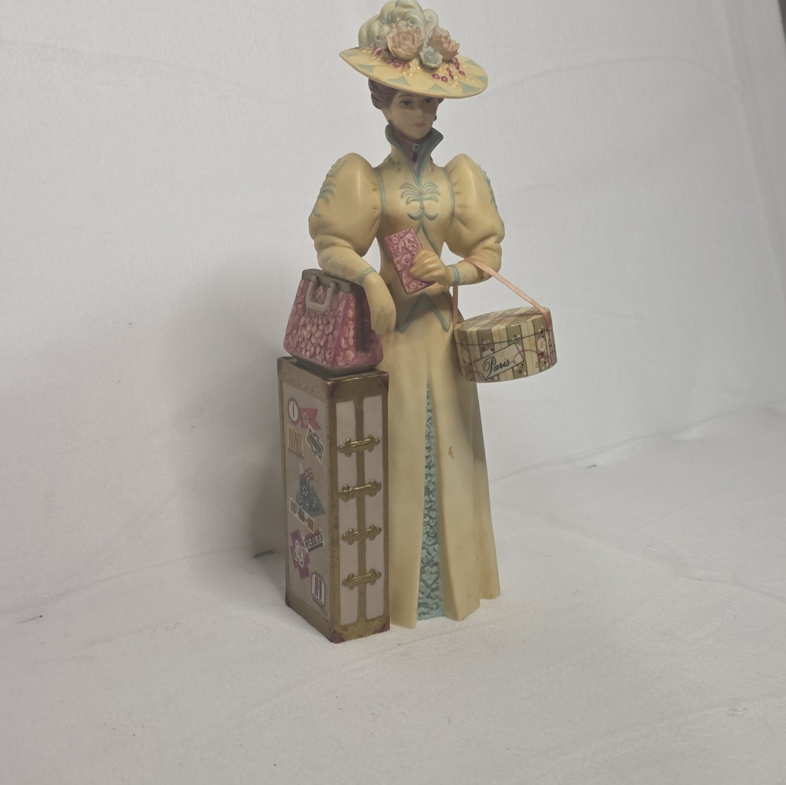 Ceramic Woman Figurine Painted Beige Multicolor Hat Suitcase Trunk People Decor