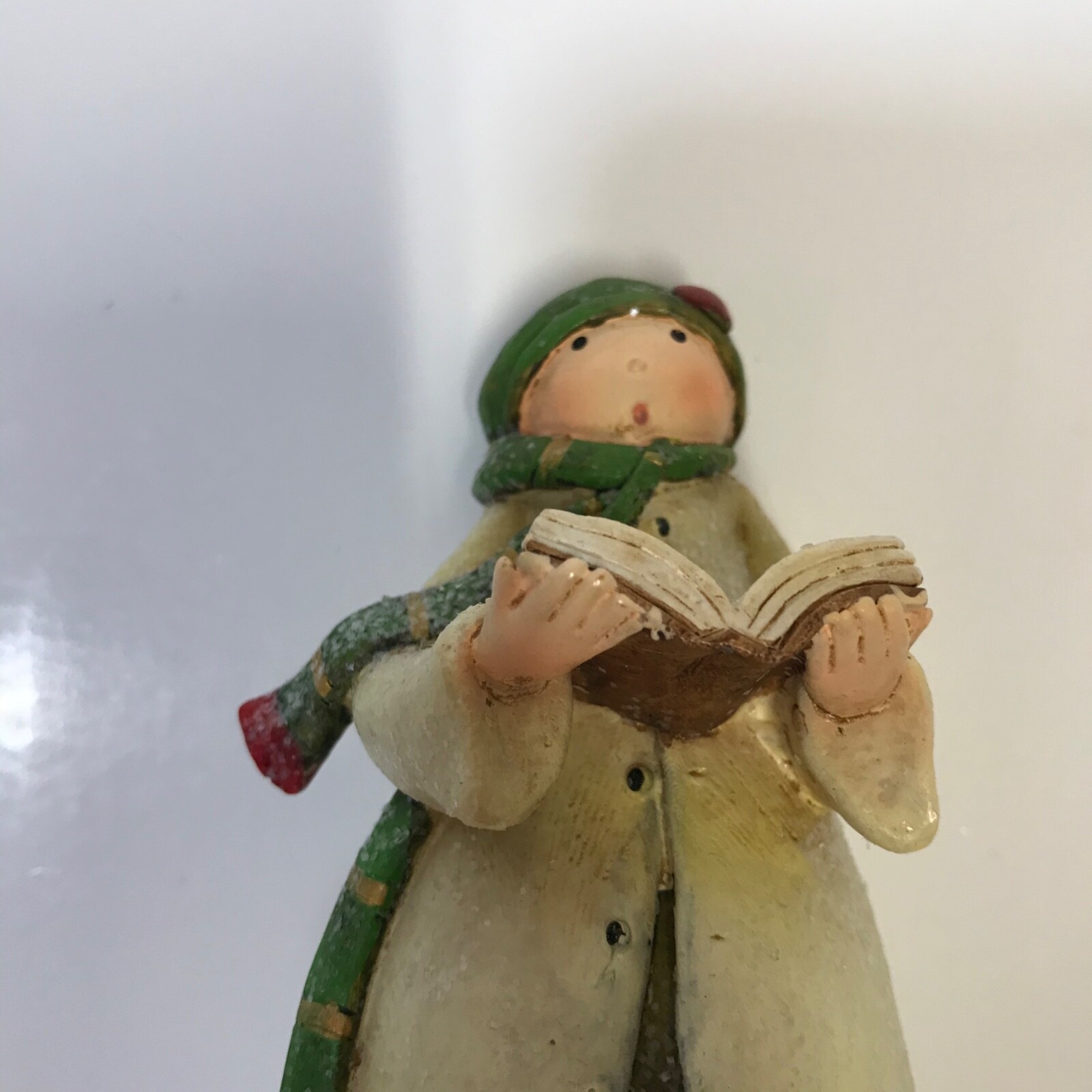 Caroler Figurine White Coat Green Scarf and Hat Red Shoes Song Book