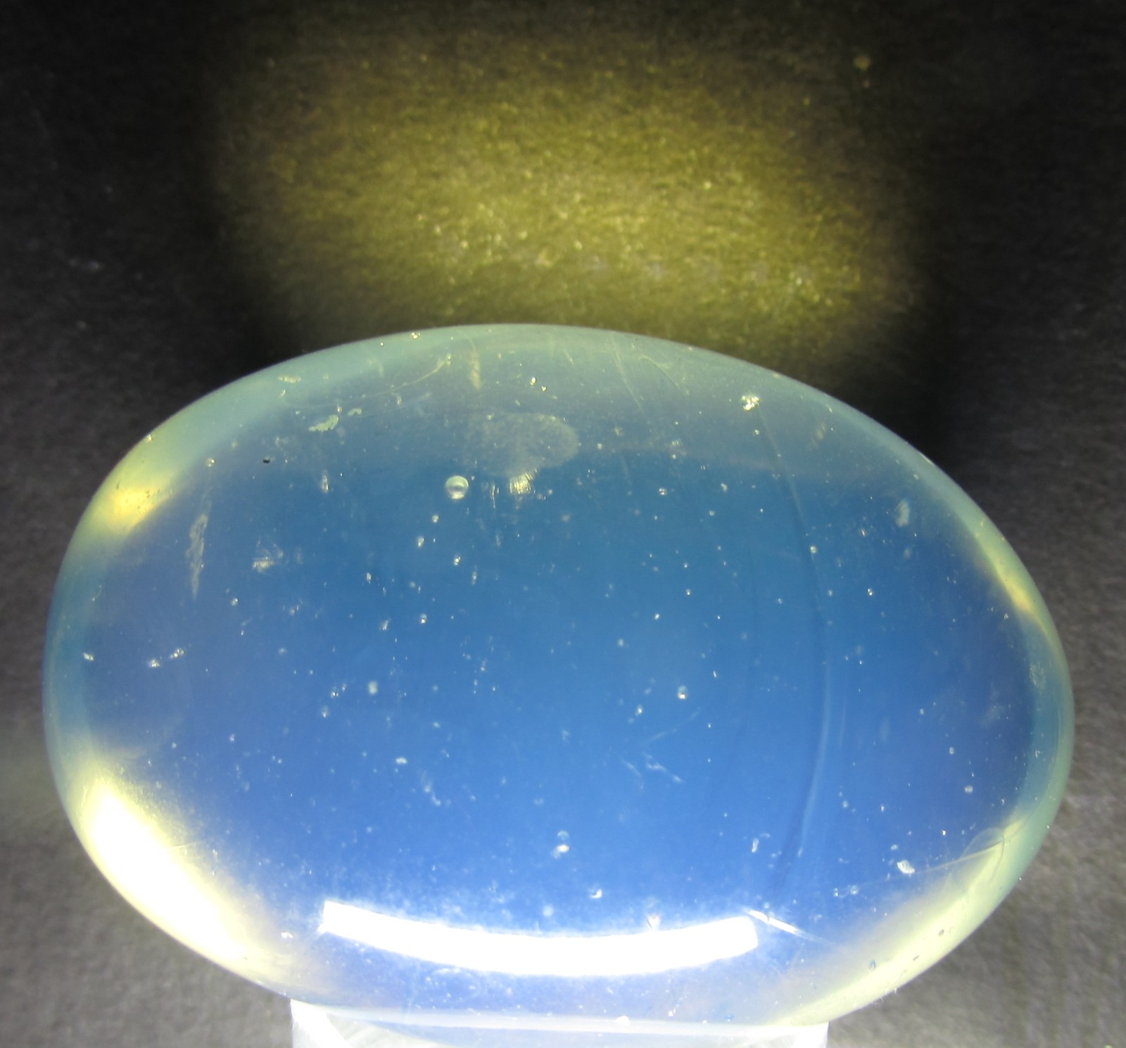 OLD HAND BLOWN OPALESCENT GLASS EGG, 2″ x 1 3/8″ OPAL BLUE + AIR BUBBLES OP32