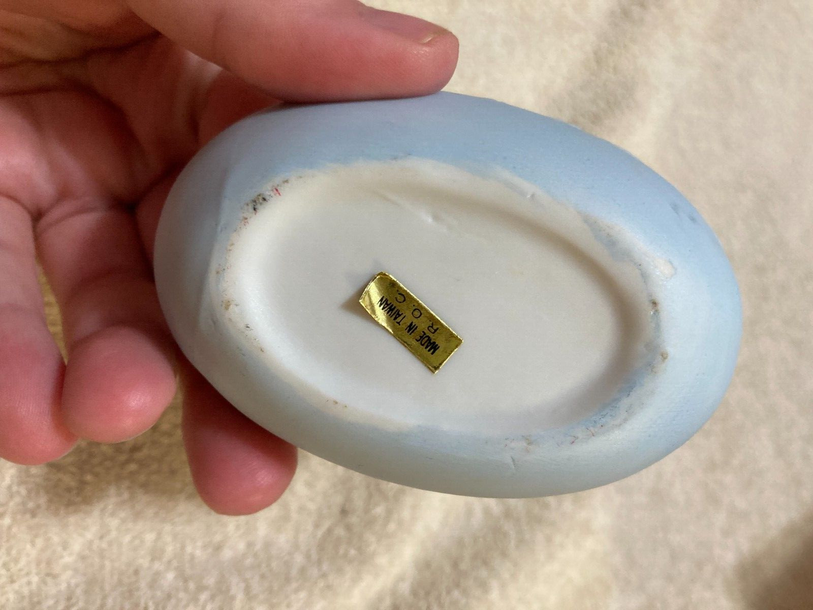 White Rabbit Holding onto Yellow +Green Egg 2 piece Egg that is Blue (Flawed)