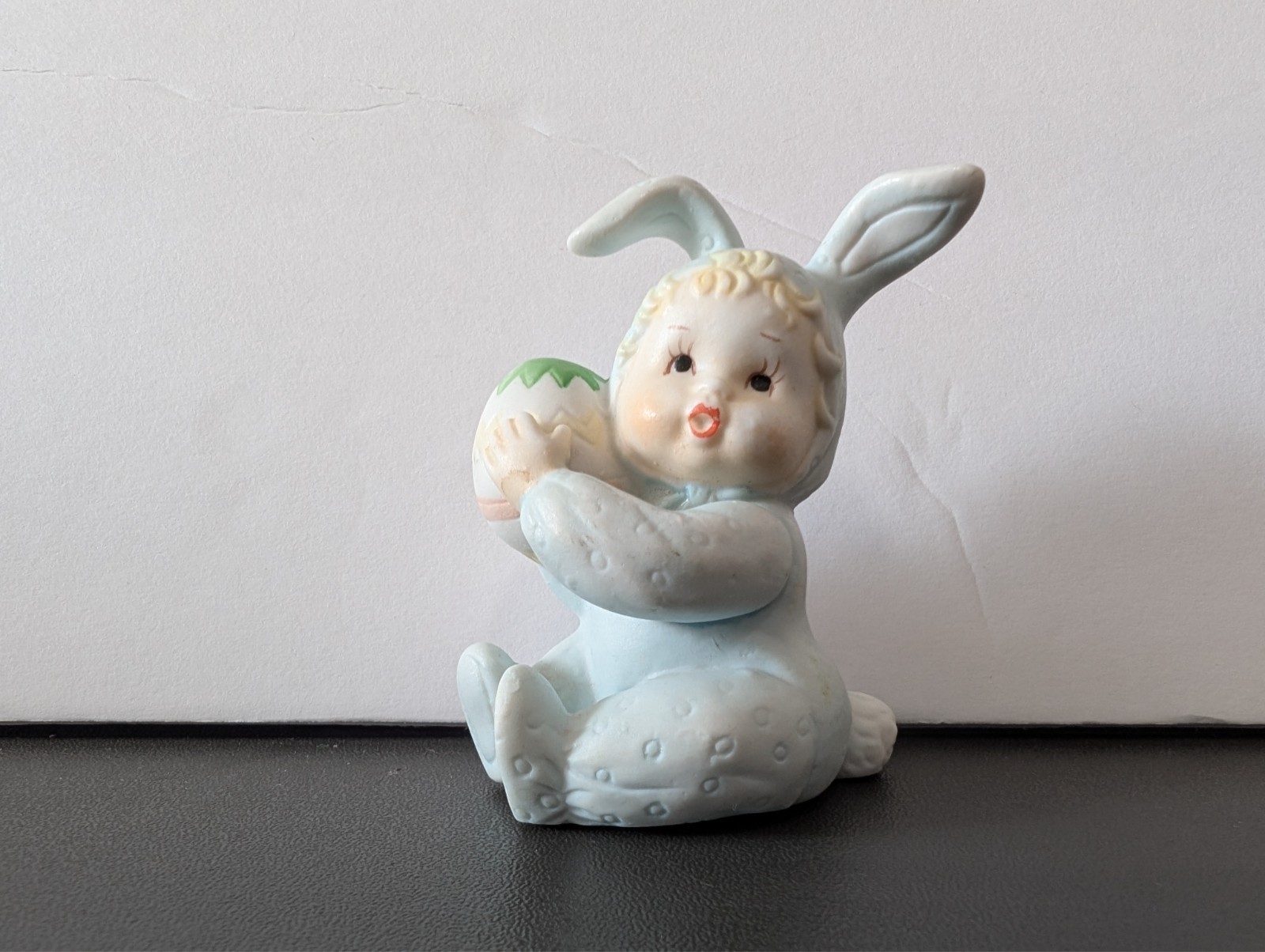 Vintage Baby in Bunny Outfit Holding an Easter Egg Approx 2 1/2″ Tall