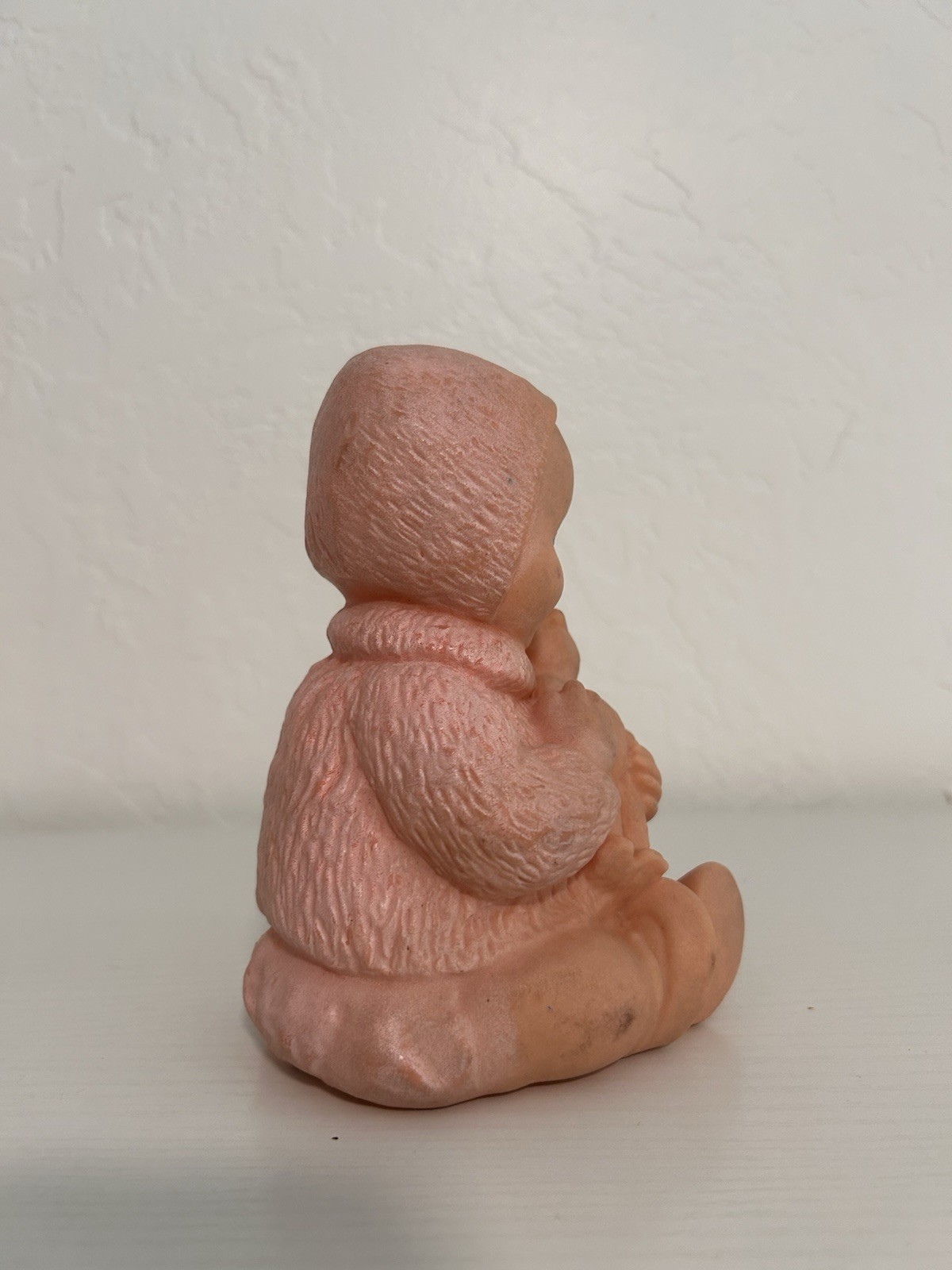 Mid 20th century model molded rubber baby figurine with teddy bear 6” height
