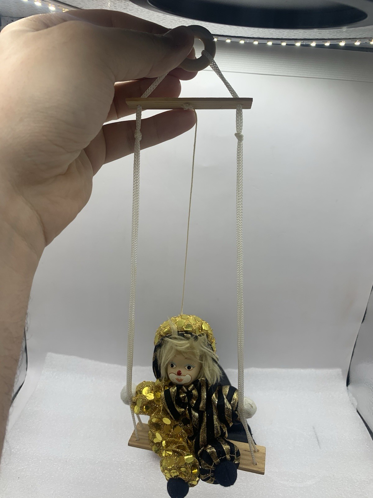 SAND DOLL CLOWN 4″ ON SWING PUPPET STRING PORCELAIN HEAD GOLD BLACK CIRCUS Bi