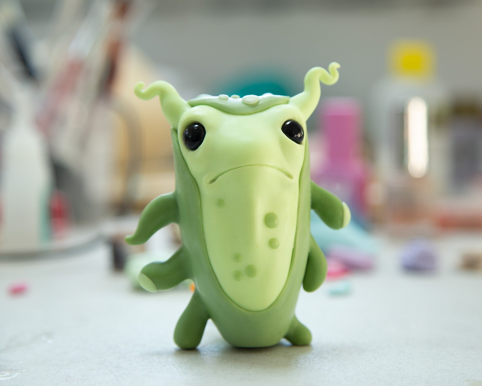 Cool and weird Germ Microbe figurine in anime style, polymer clay creature doll