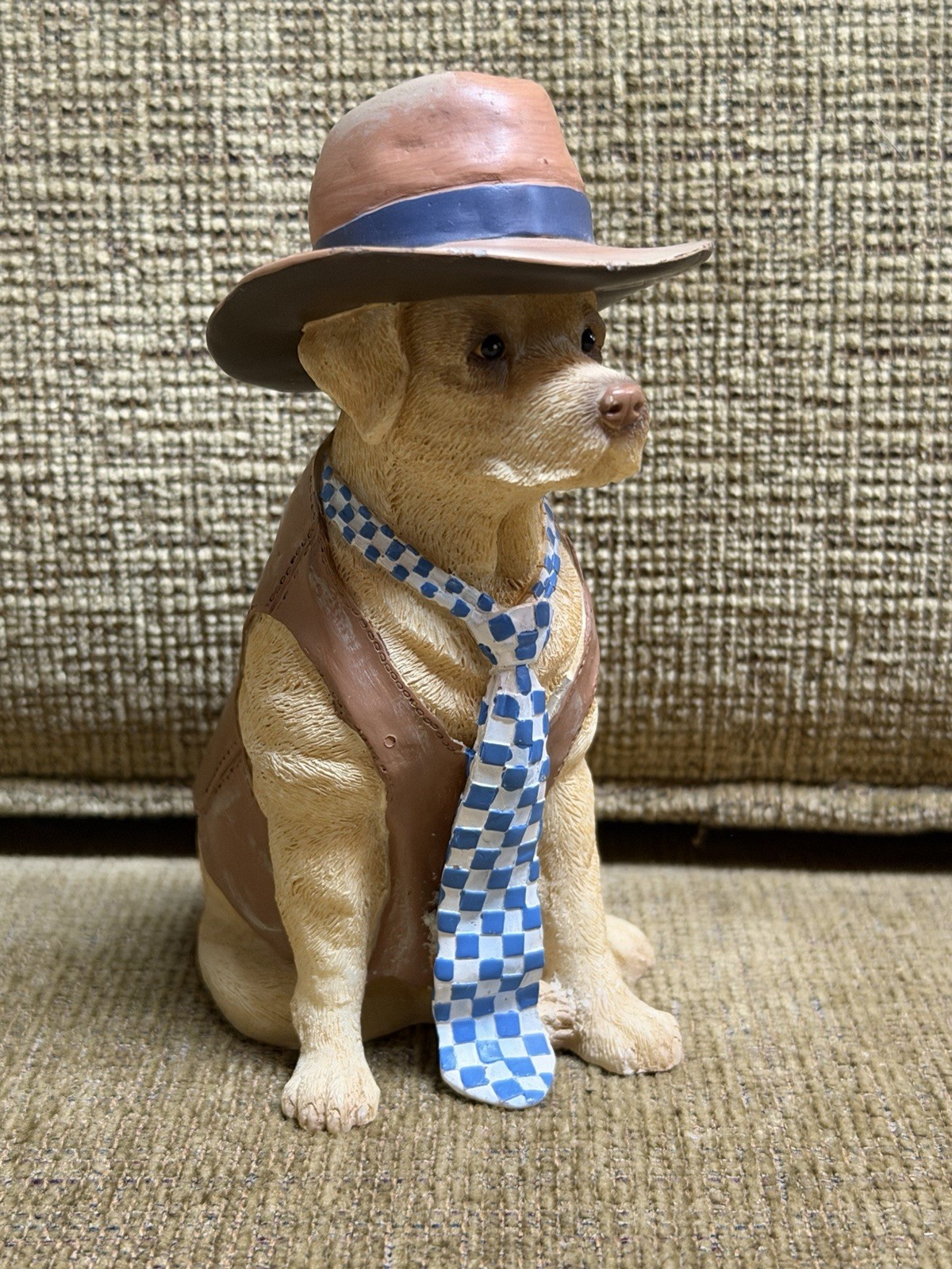lifelike dog figurine in clothes