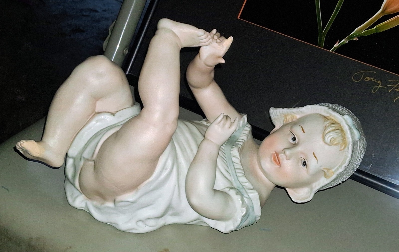 Gebruder Heubach-German Porcelain Bisque-Lying On Back Piano Baby–11″ Length