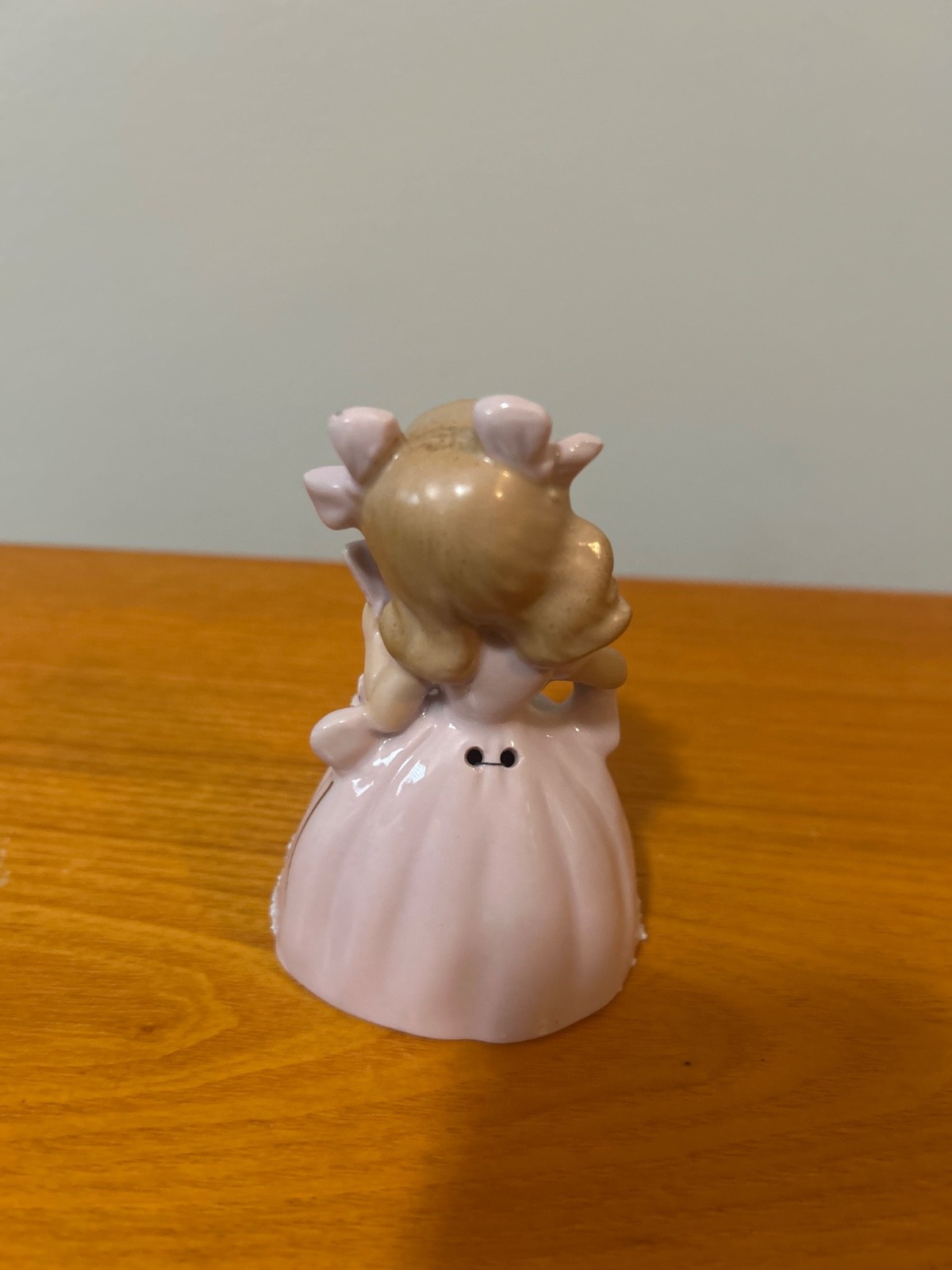 vintage ucagco girl in pink dress holding fan bell