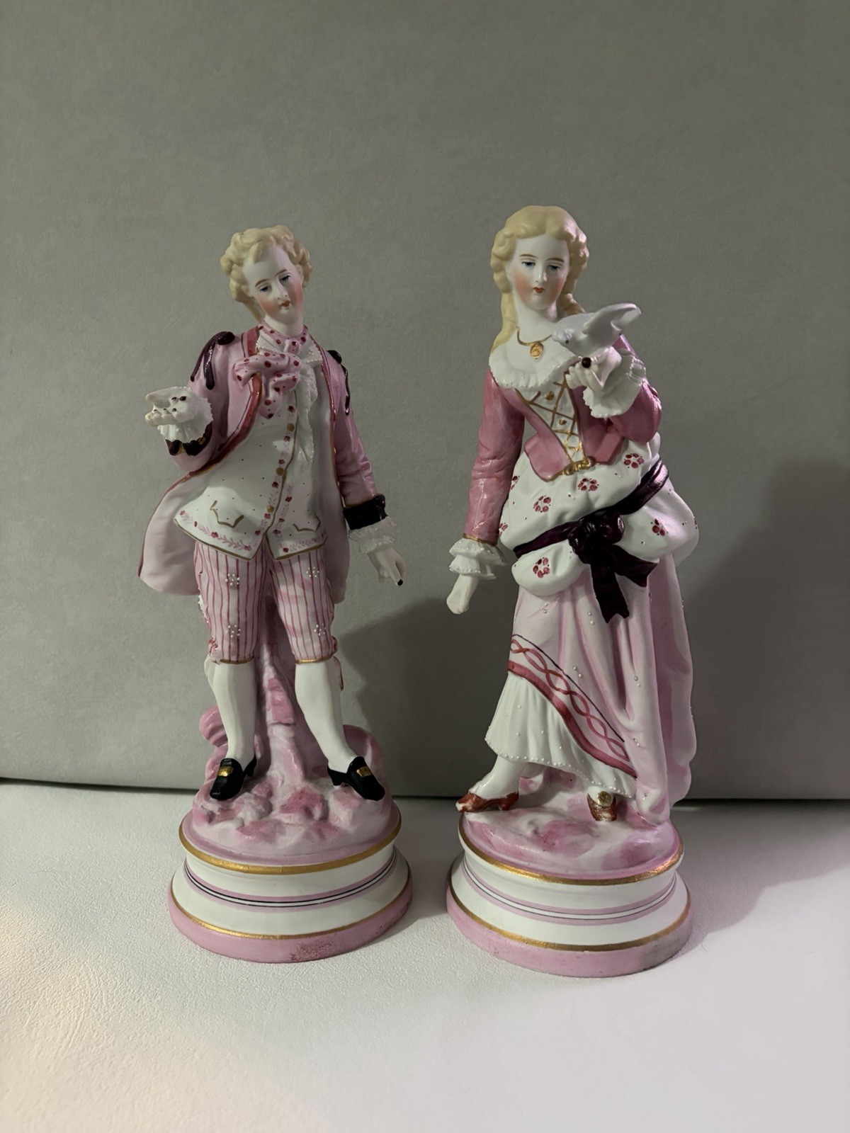 Pair Of Porcelain Figurines, 18th Century Style Man And Women In Pink Attire