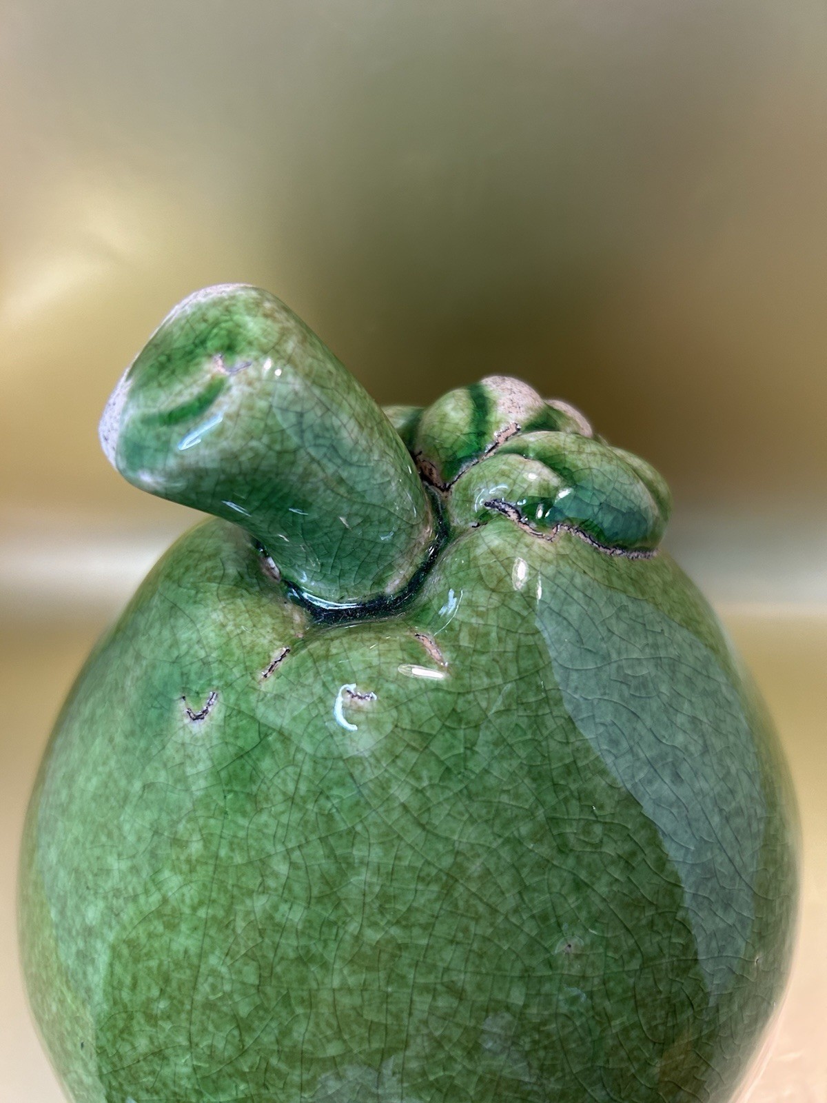 Vintage Mid-Century Modern (MCM) crackle-glazed green ceramic pear figurine.