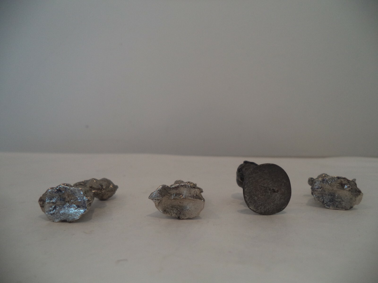 4 tiny metal girl figures 2 playing instruments 1 reading a book 1 ANGLE 1.5″