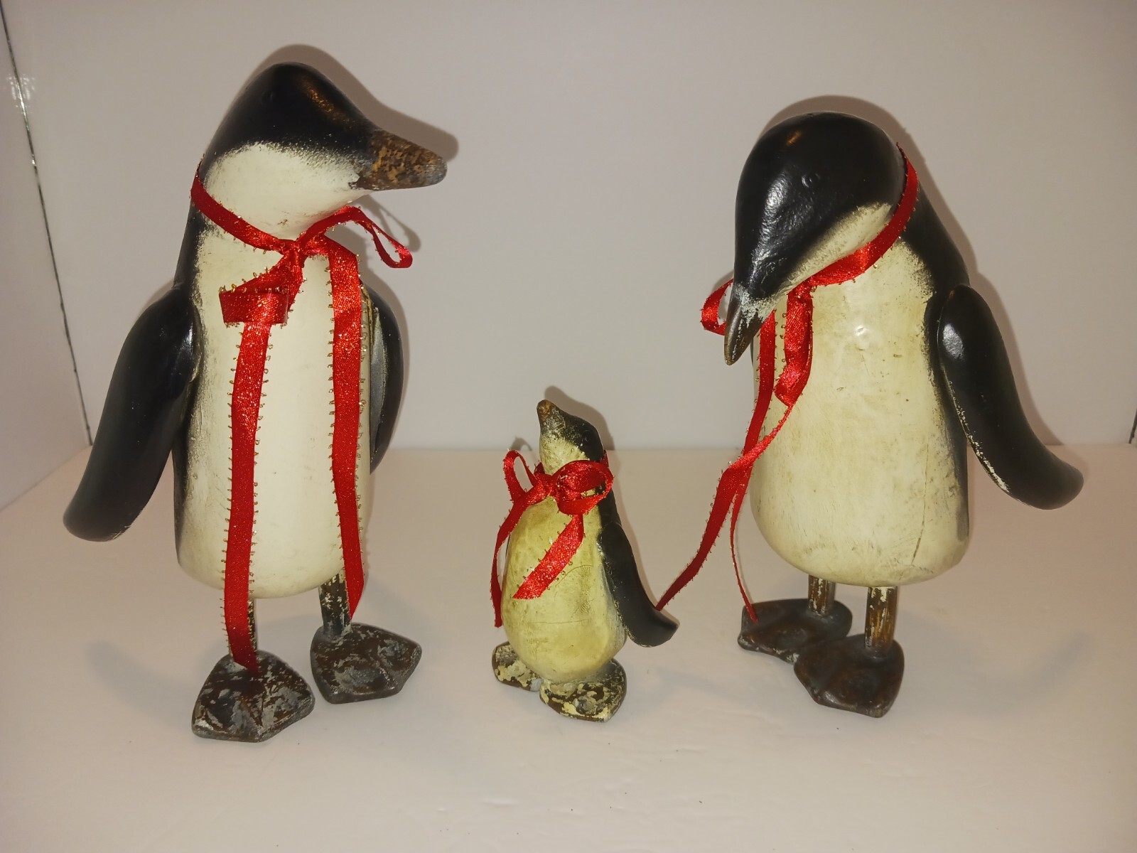 Family of Penguins Sculptures Set of 3,Father, Mother & Baby wearing Red Ribbons