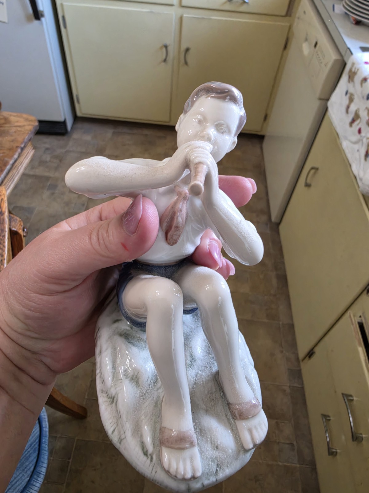 A product of the Danish manufacturer Bing & Grøndahl. “Boy playing flute”