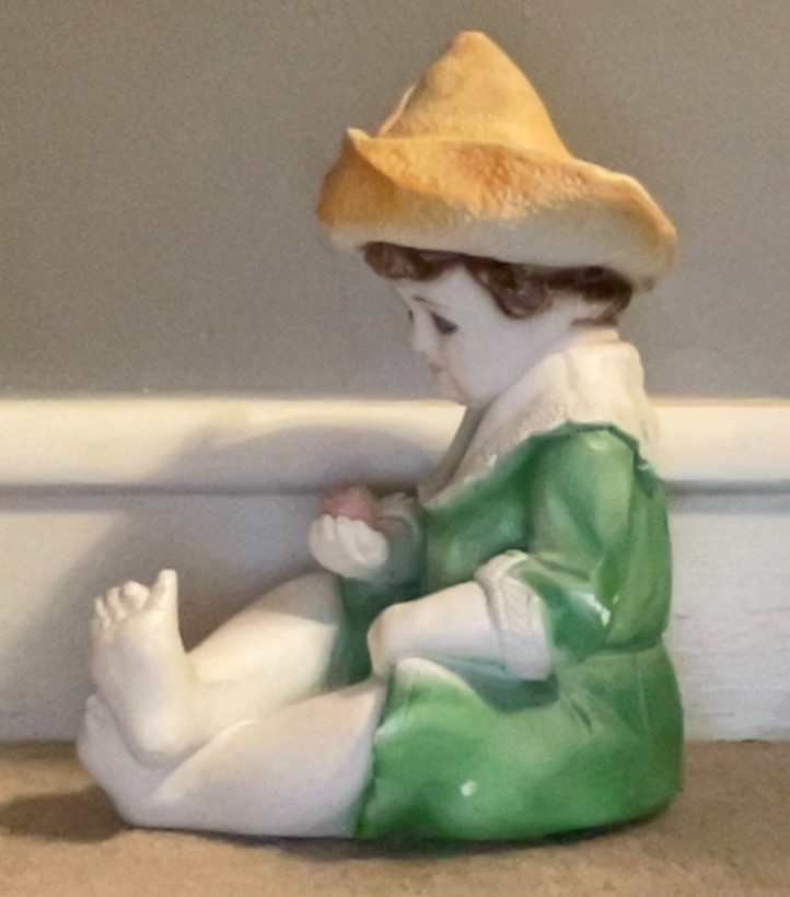 Large Ceramic or Chalk Figurine. Young Boy Holding an Apple. 12″ x 7″.
