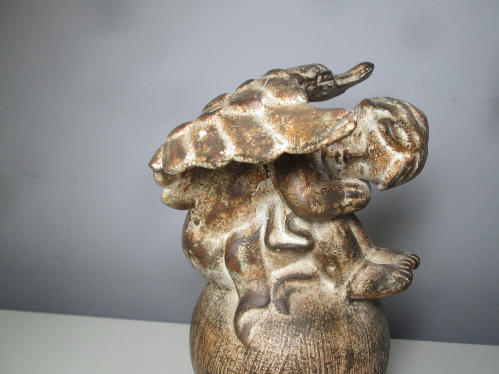 Ceramic Cherub on a Globe inside or outside Décor