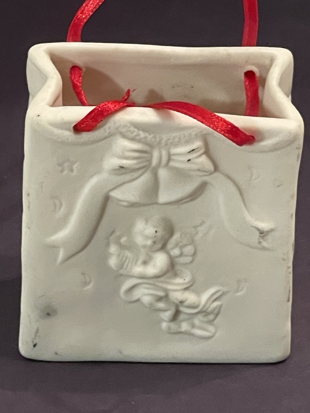 Autom China White Porcelain Cherub Bag With Red Ribbon Handle