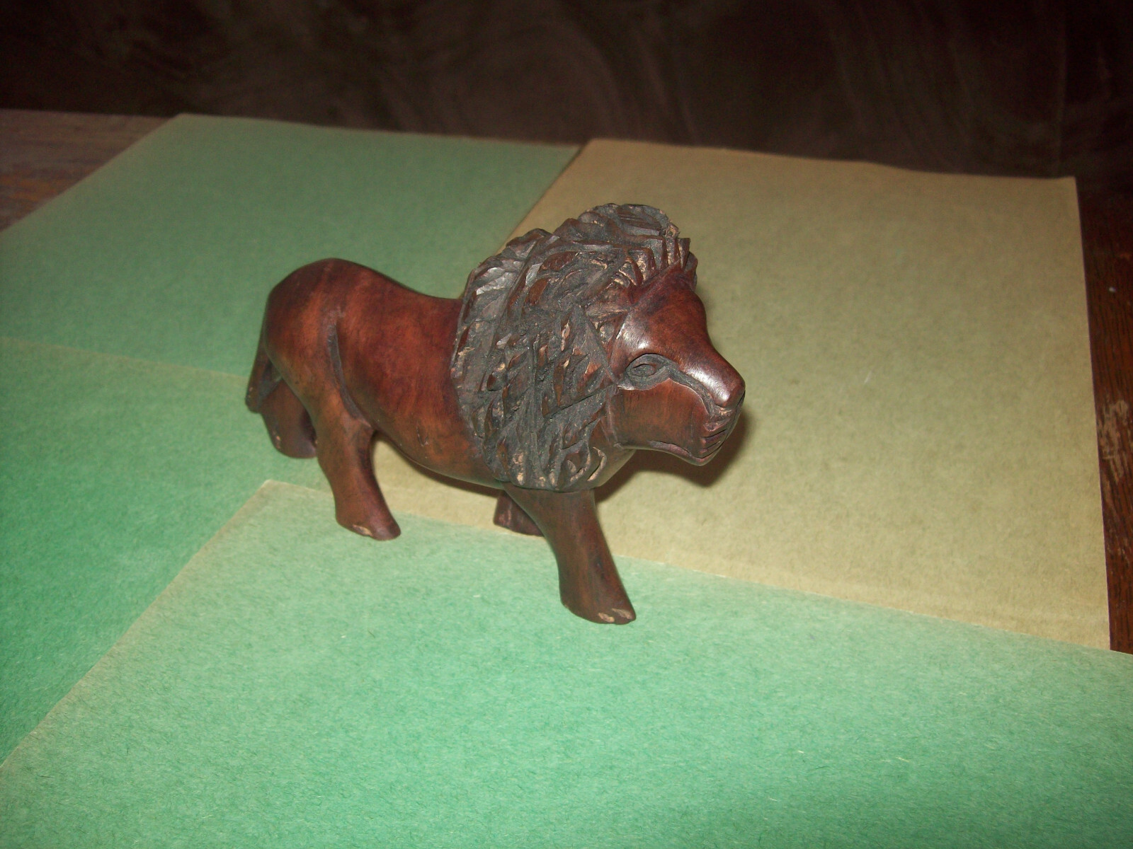 HAND CARVED D.BROWN WOOD LION FIGURINE