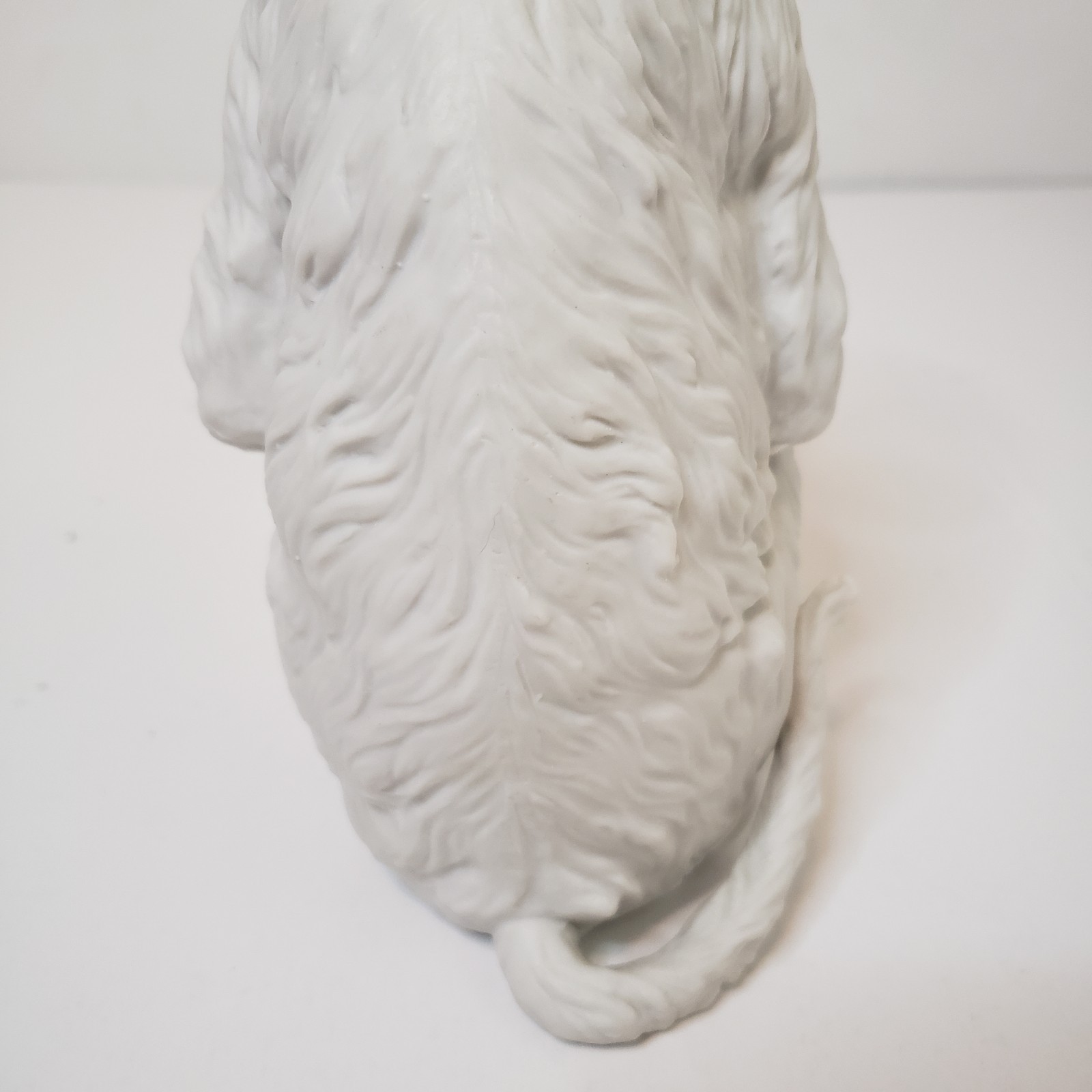 White Bisque Porcelain Sitting Monkey Holding Rock Figurine Vintage