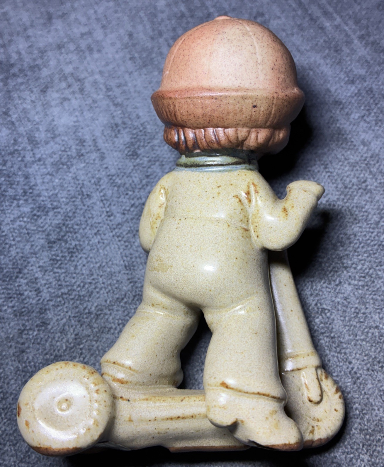 Vintage UCTCI Speckled Stoneware FIGURINE boy riding a scooter 1970’s Japan