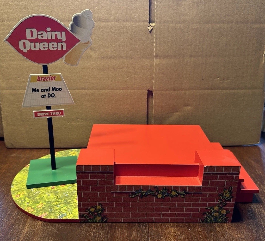 Mary’s Moo Moos Dairy Queen Figurine Display And Parking Lot Sign