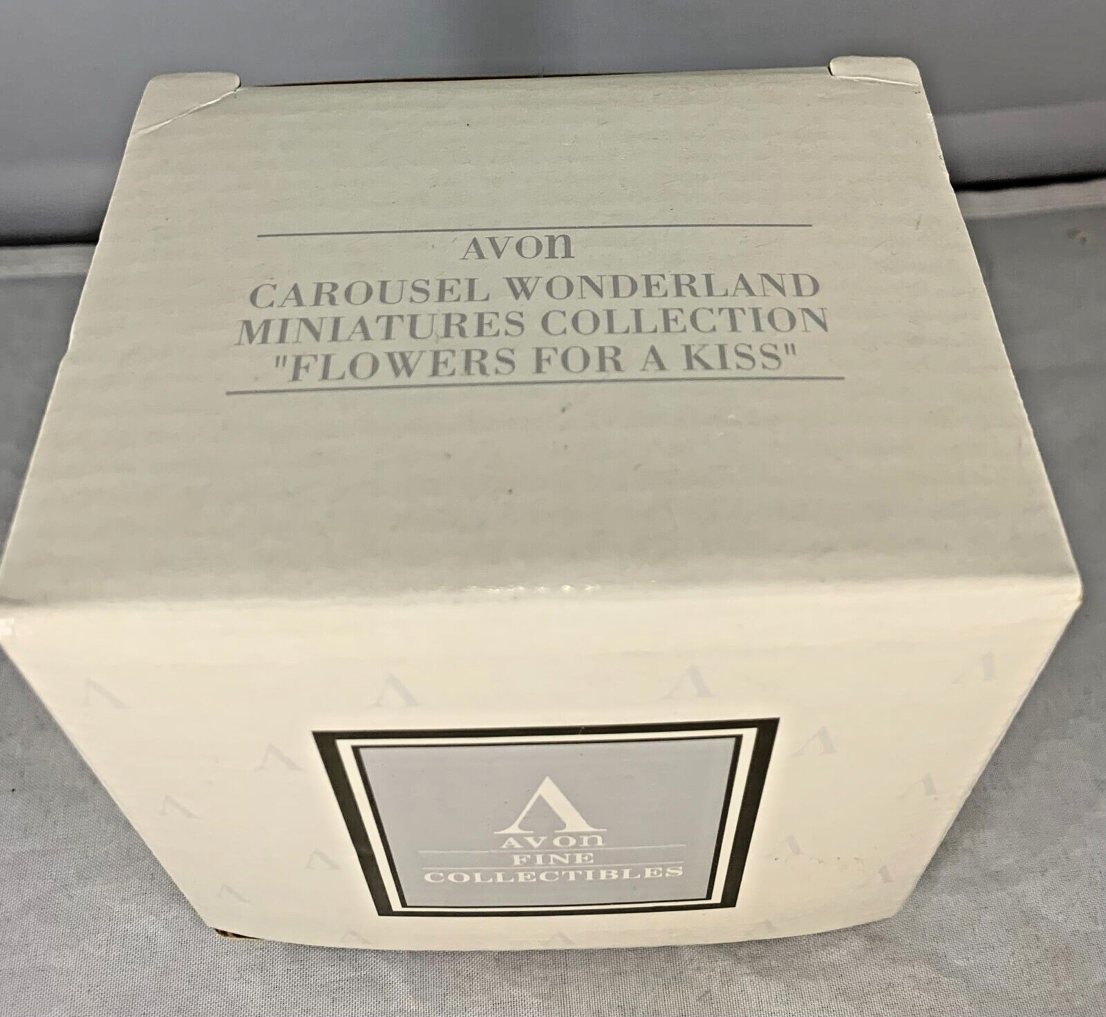 AVON CAROUSEL WONDERLAND MINIATURES COLLECTION “FLOWERS FOR A KISS”