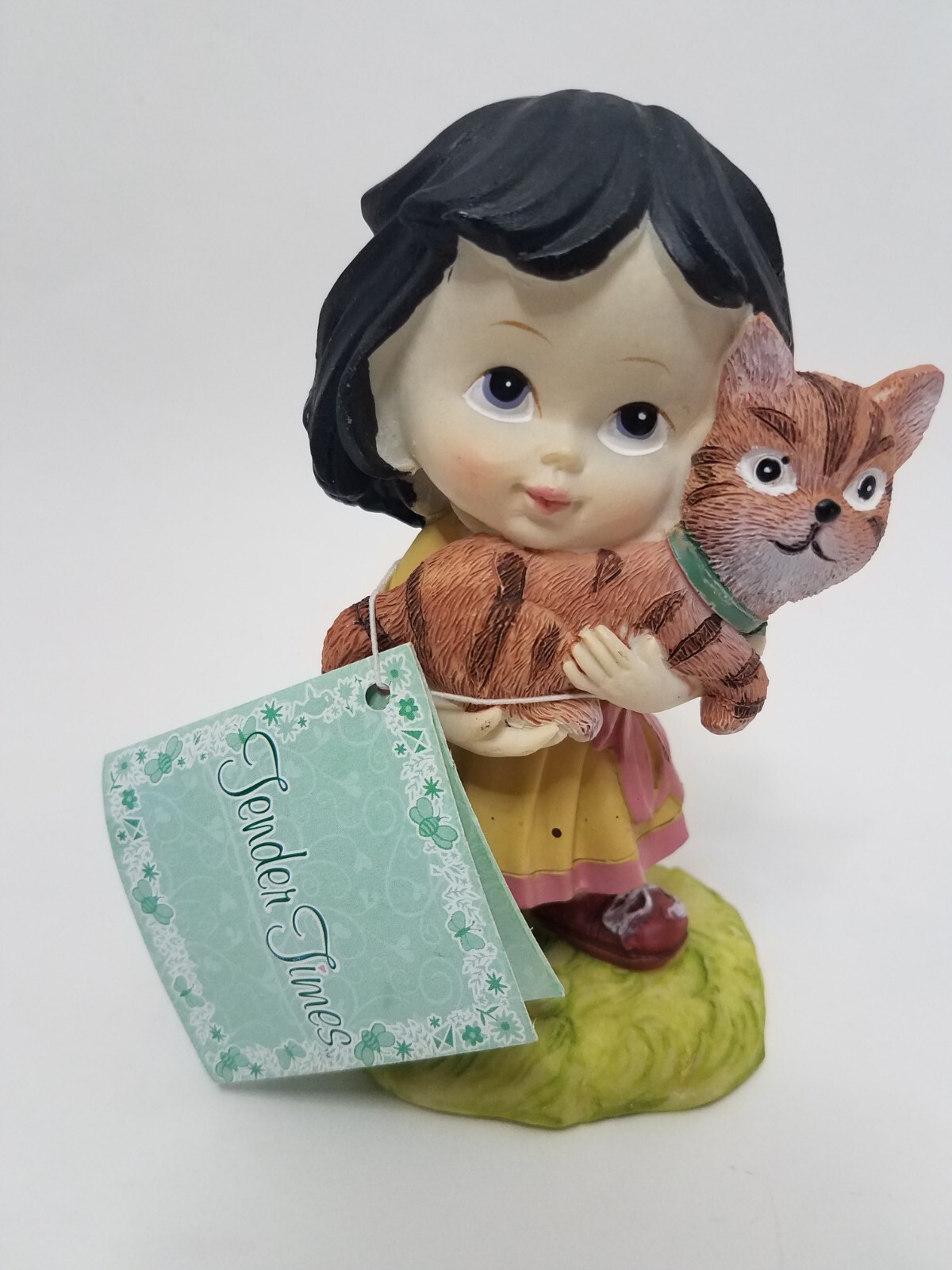 Tender Times Girl Holding Cat