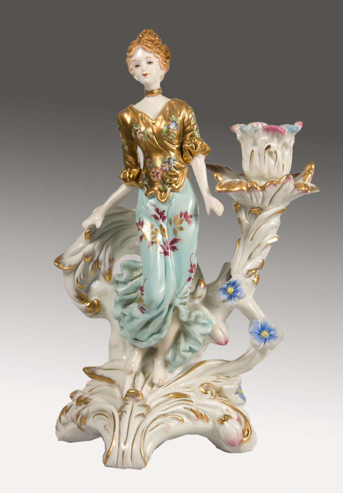 Pair of porcelain candle holders or candlesticks, after models from Sèvres.