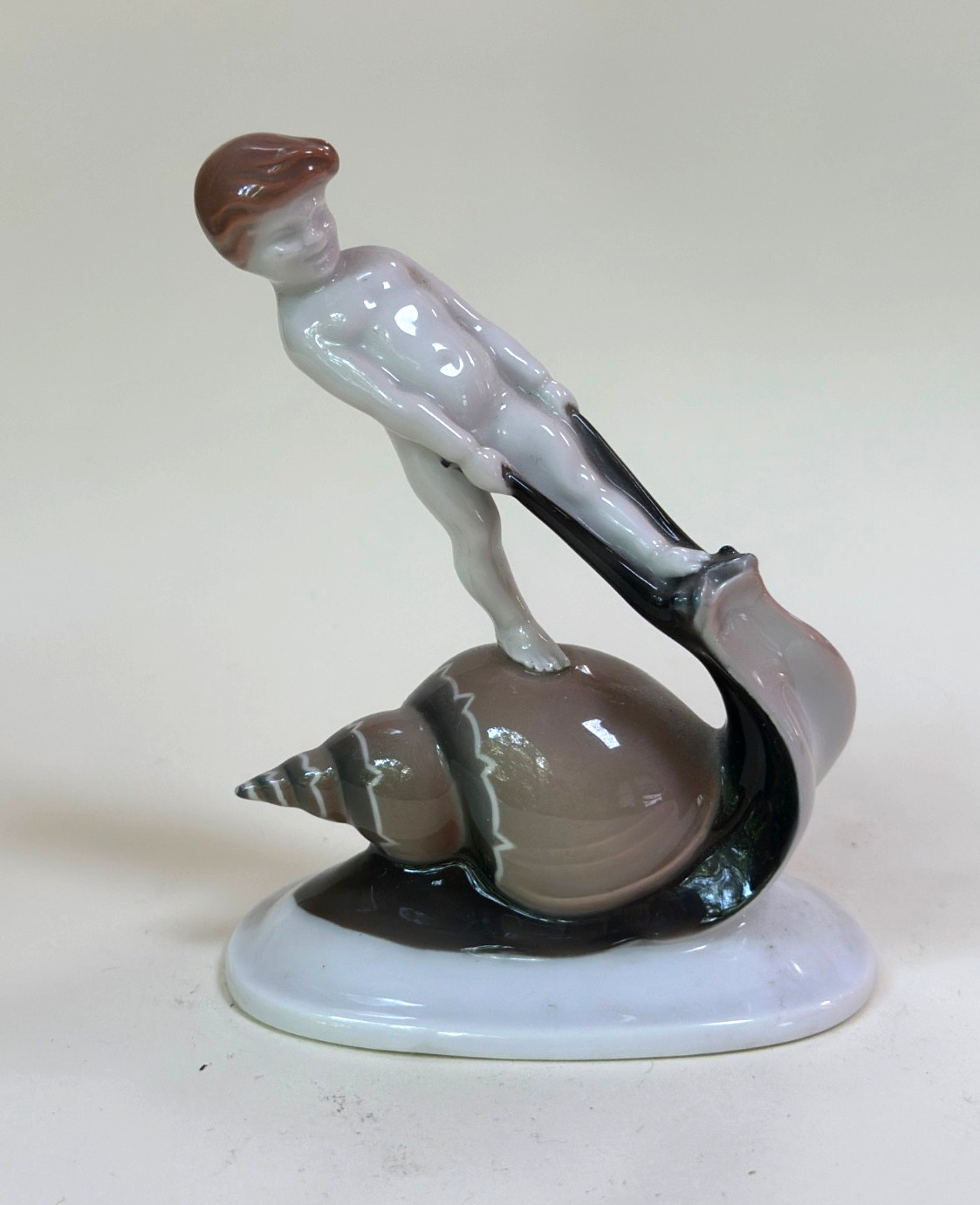 Rosenthal Selb-Bavaria figurine of boy riding a snail by Albert Caasmann c. 1924