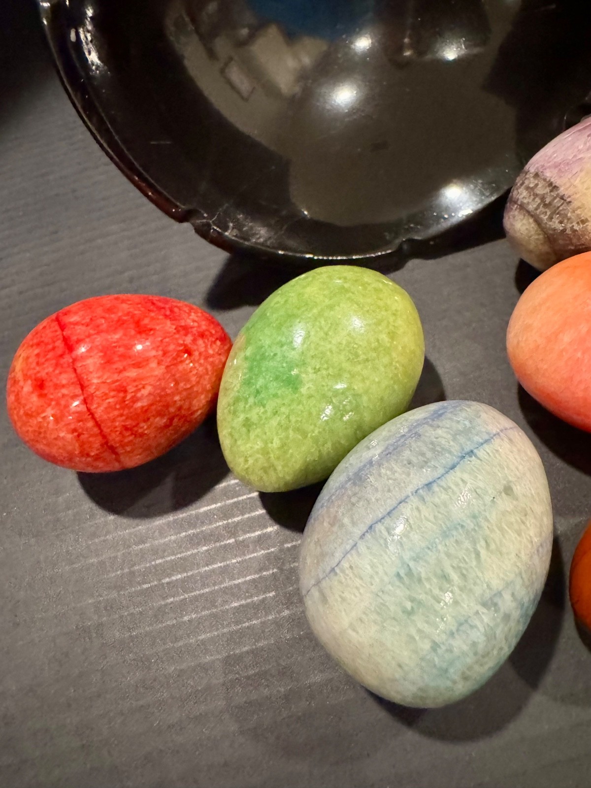 Alabaster black basket with 7 multi-colored eggs
