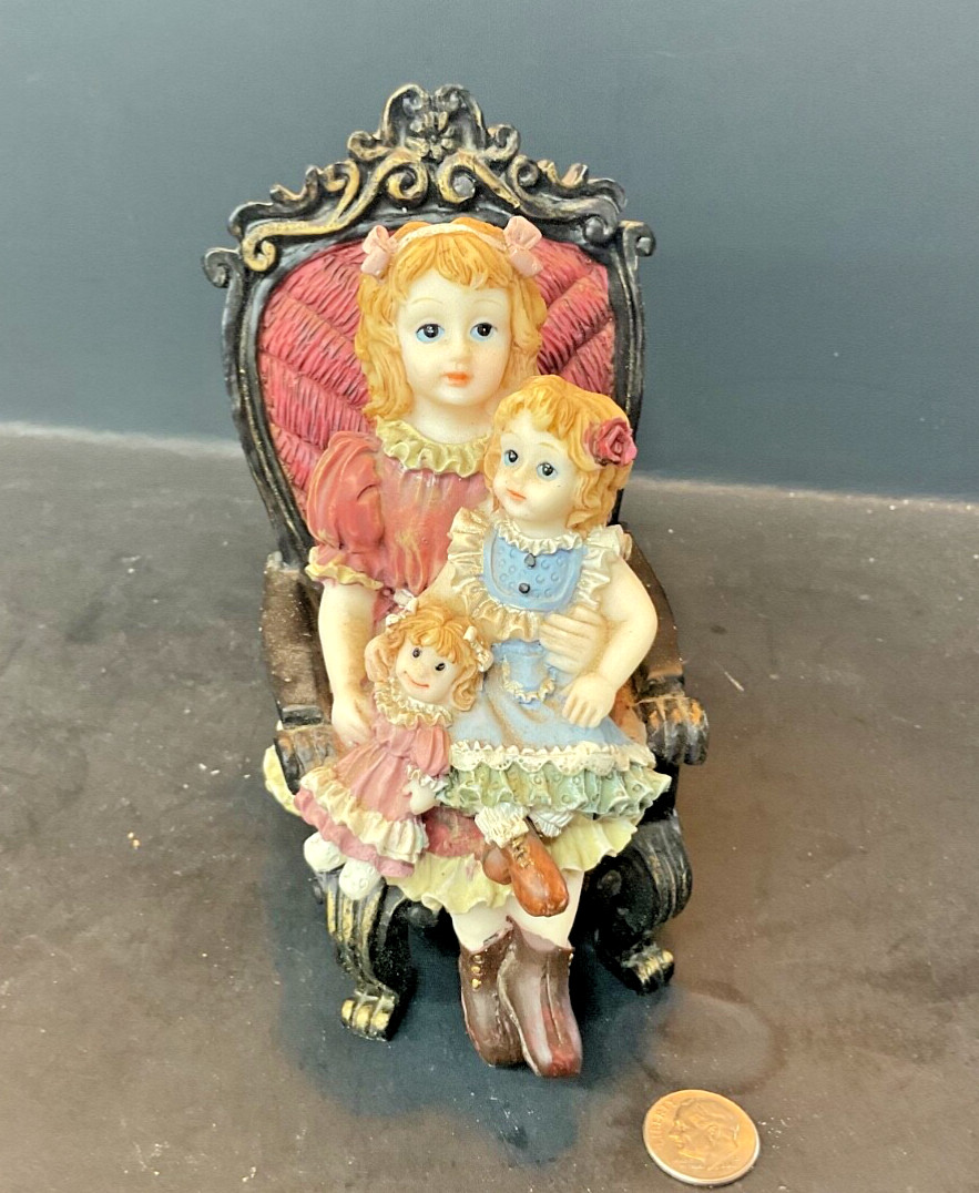 VNT Turtle King Corp.Figurine Girl Holding Sister & Doll in Chair