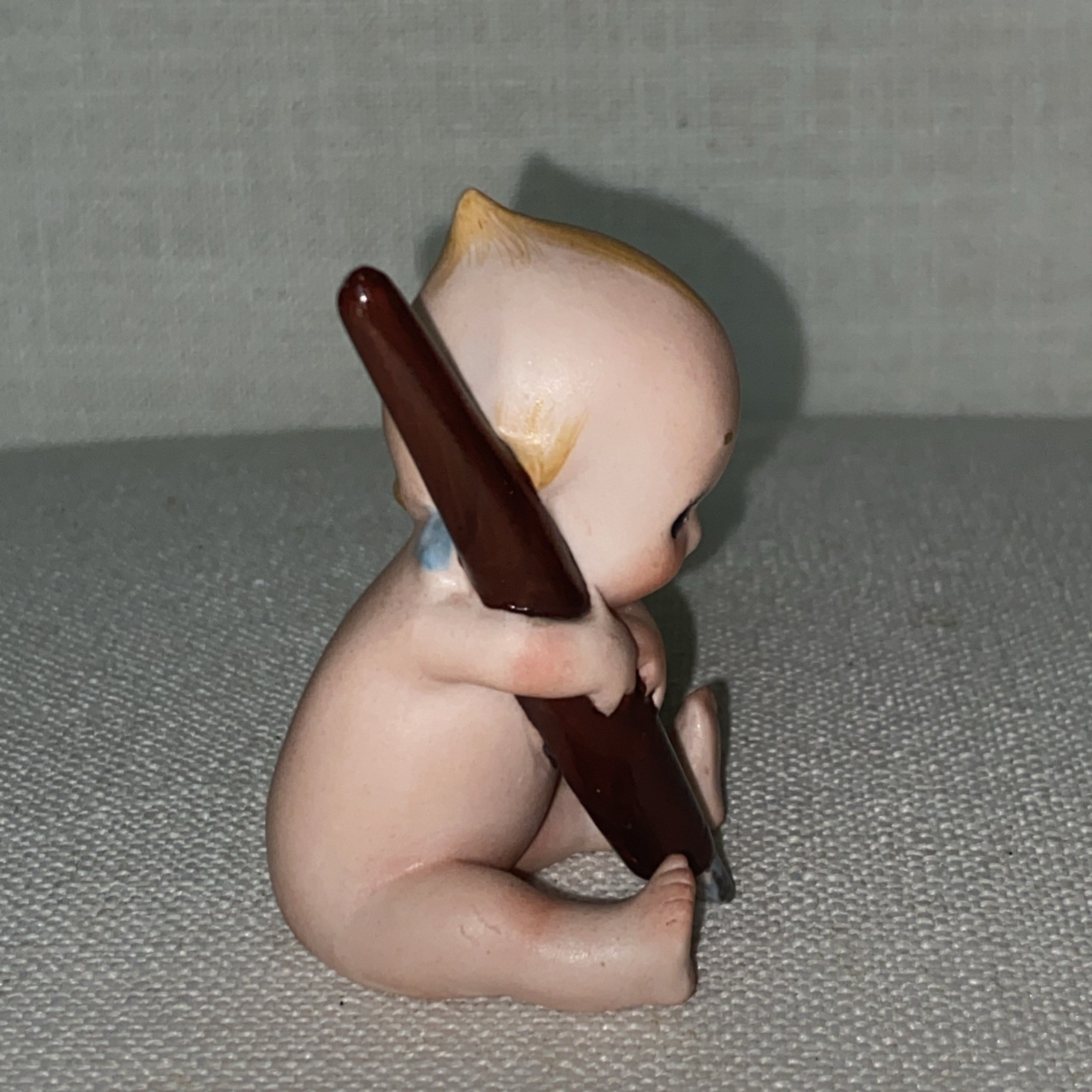 Antique Rare Rose O’Neil porcelain Kewpie Doll Holding Pen ex condition 3″