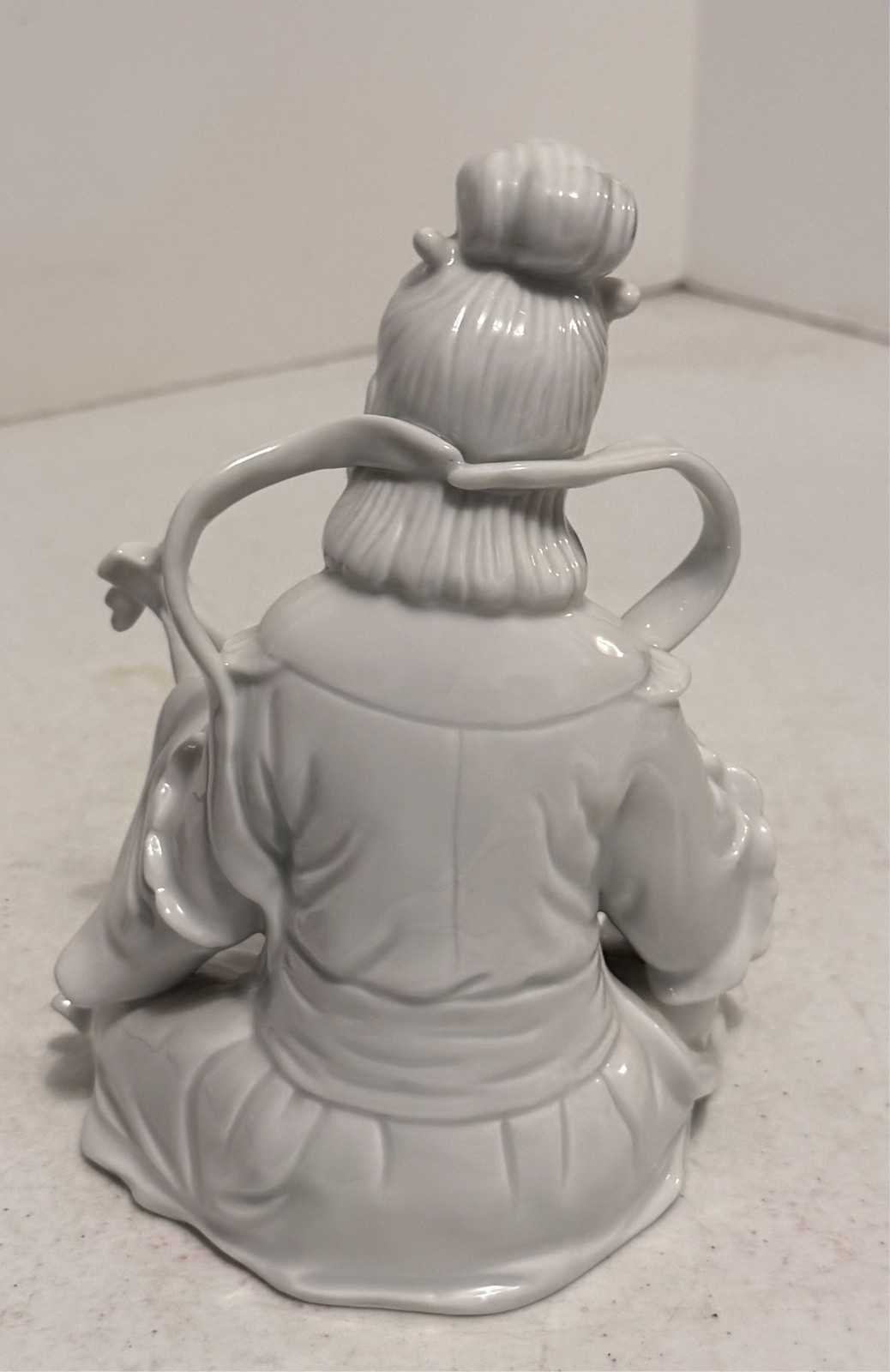 Japanese White Porcelain Geisha Sitting Playing a Biwa